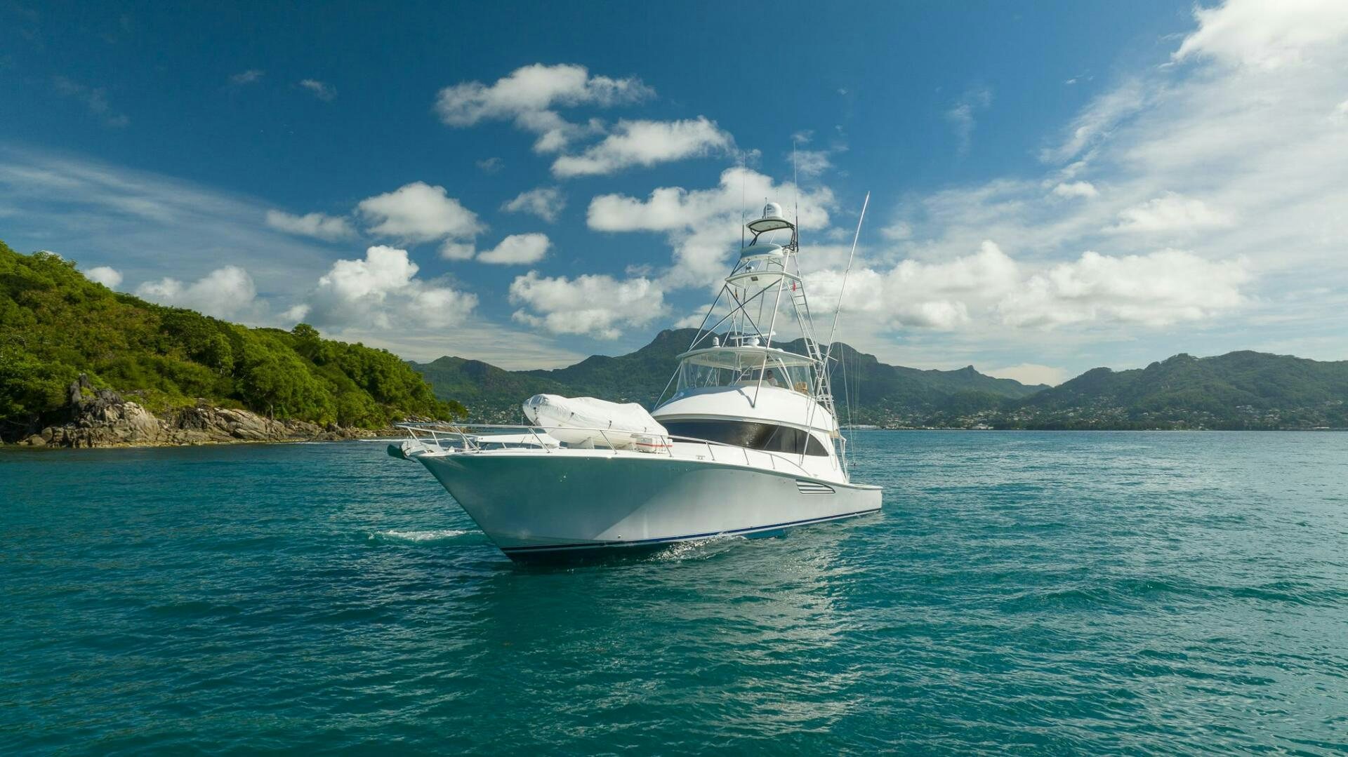 a white boat on the water aboard VOODOO Yacht for Sale