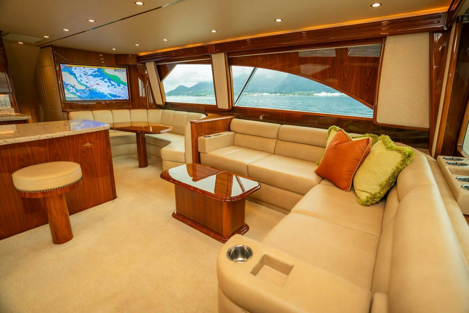 a living room with a large window aboard VOODOO Yacht for Sale