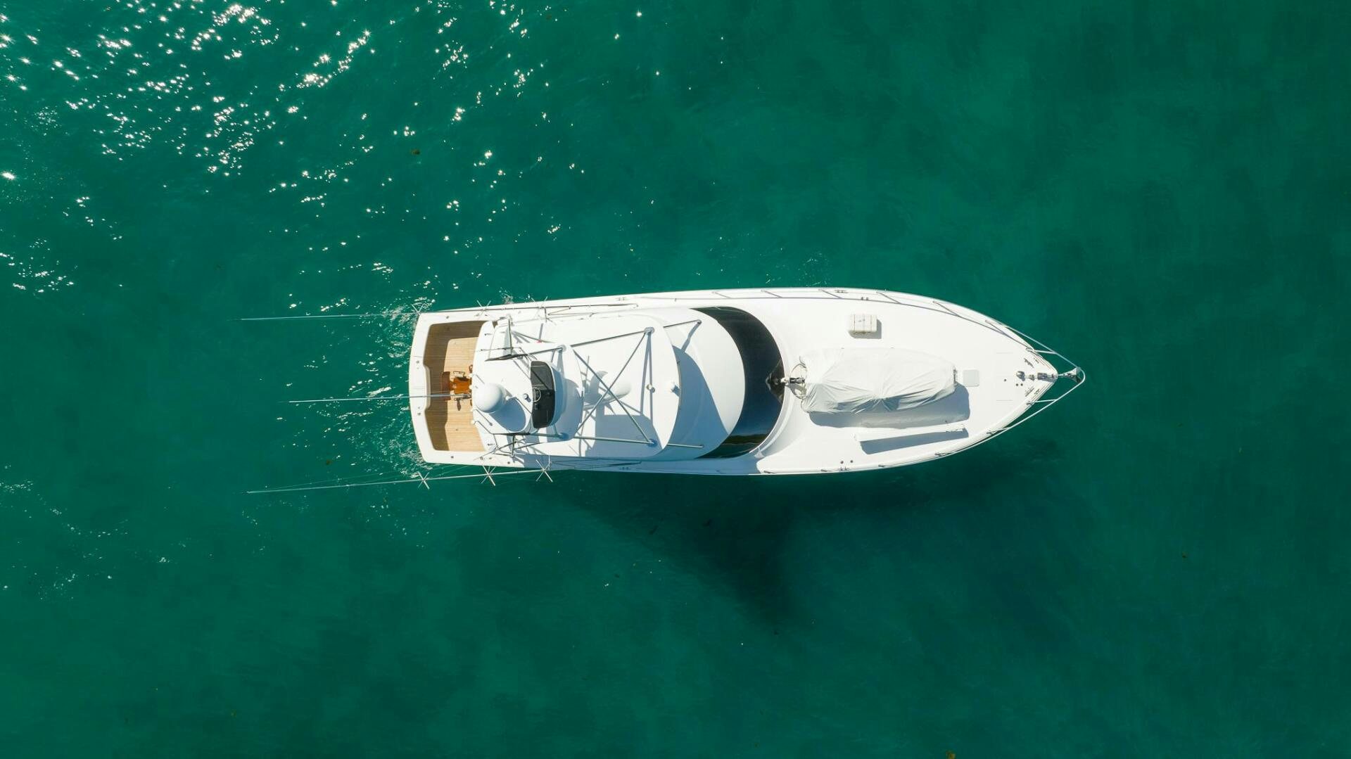 a white boat in the water aboard VOODOO Yacht for Sale