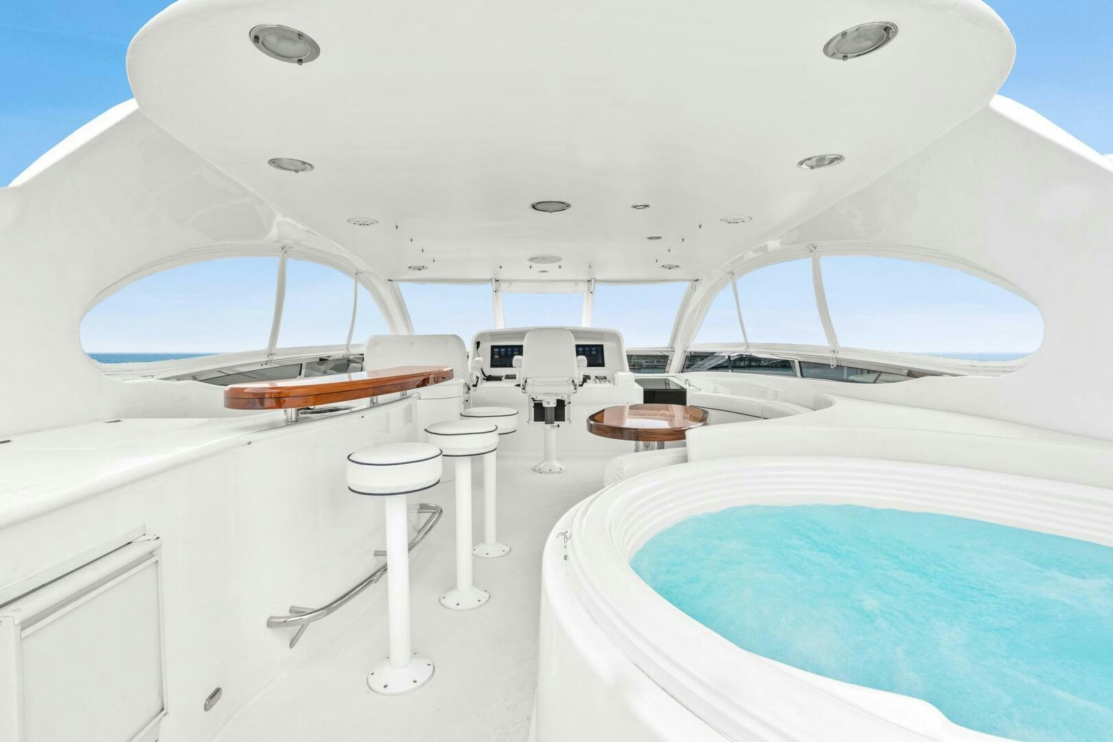 a room with a bed and a table aboard HIGH LIFE Yacht for Sale