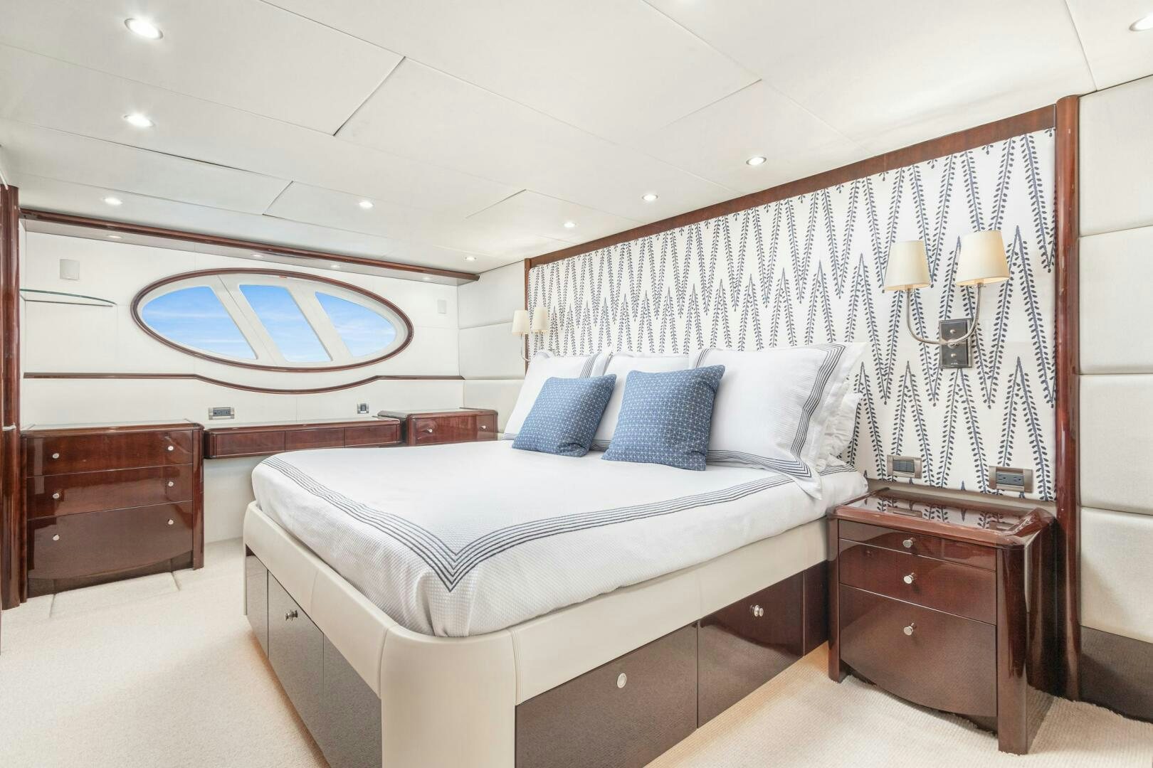 a bedroom with a bed and a window aboard HIGH LIFE Yacht for Sale