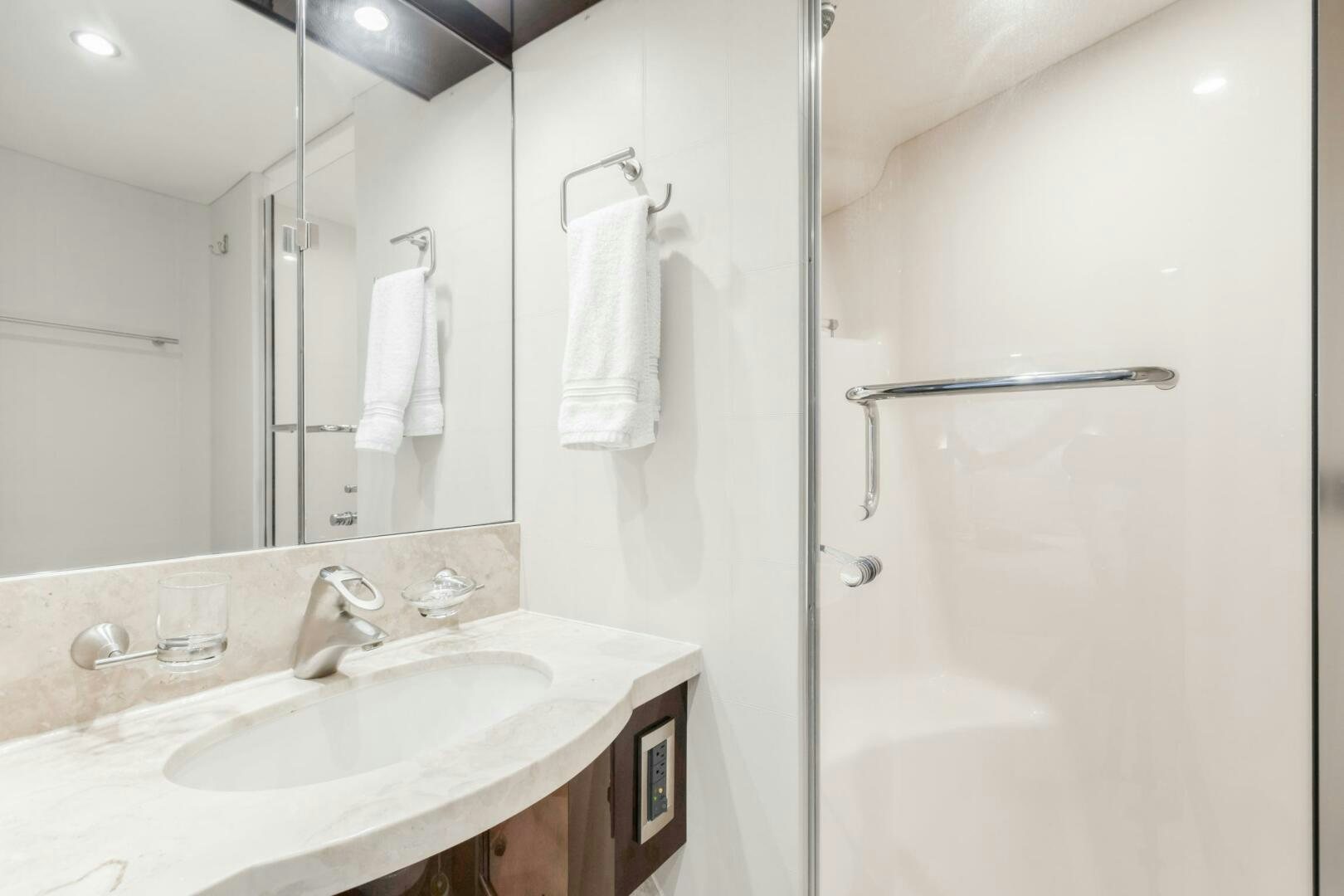 a bathroom with a sink and a shower aboard HIGH LIFE Yacht for Sale
