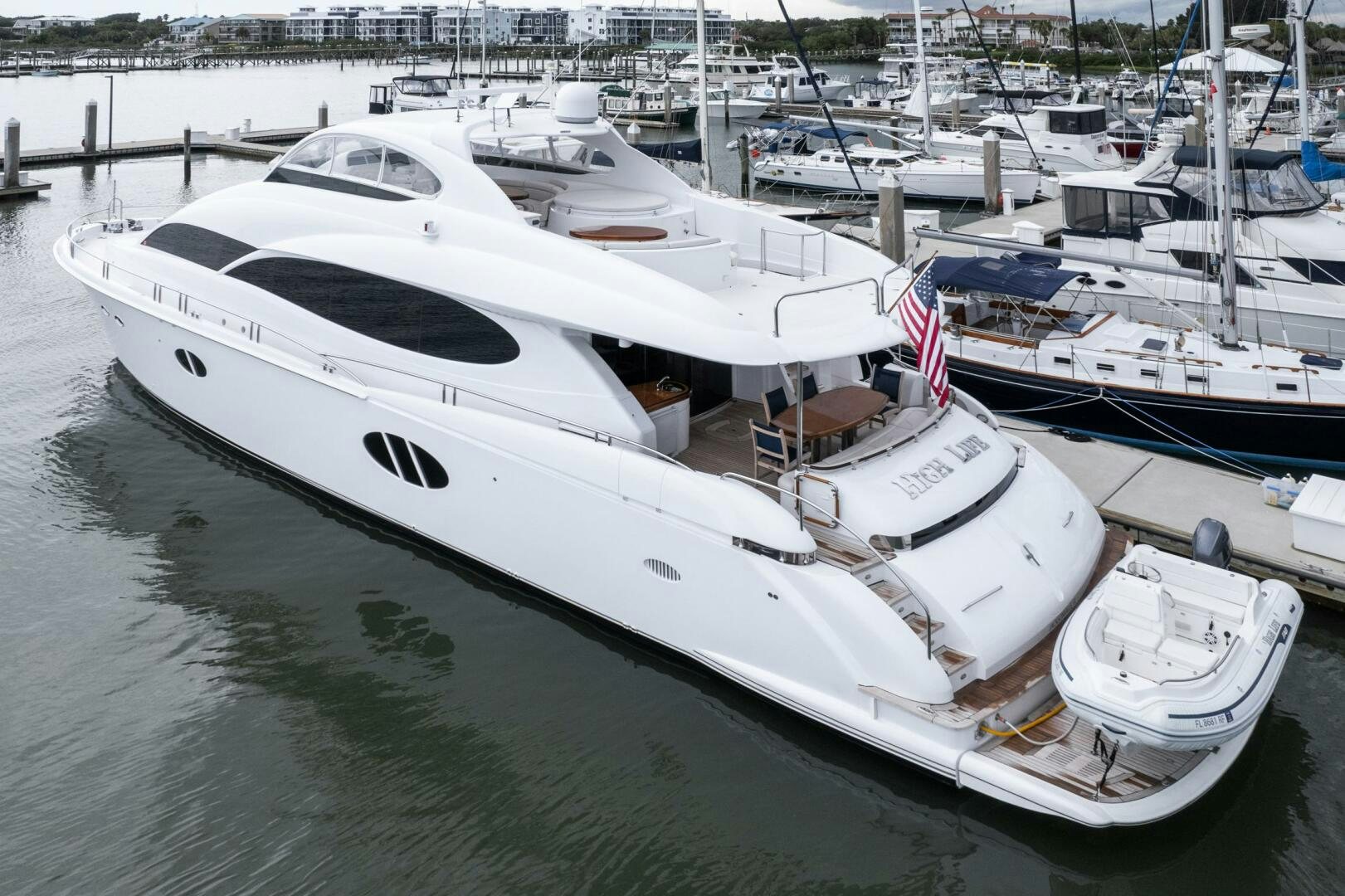 a boat parked in a harbor aboard HIGH LIFE Yacht for Sale