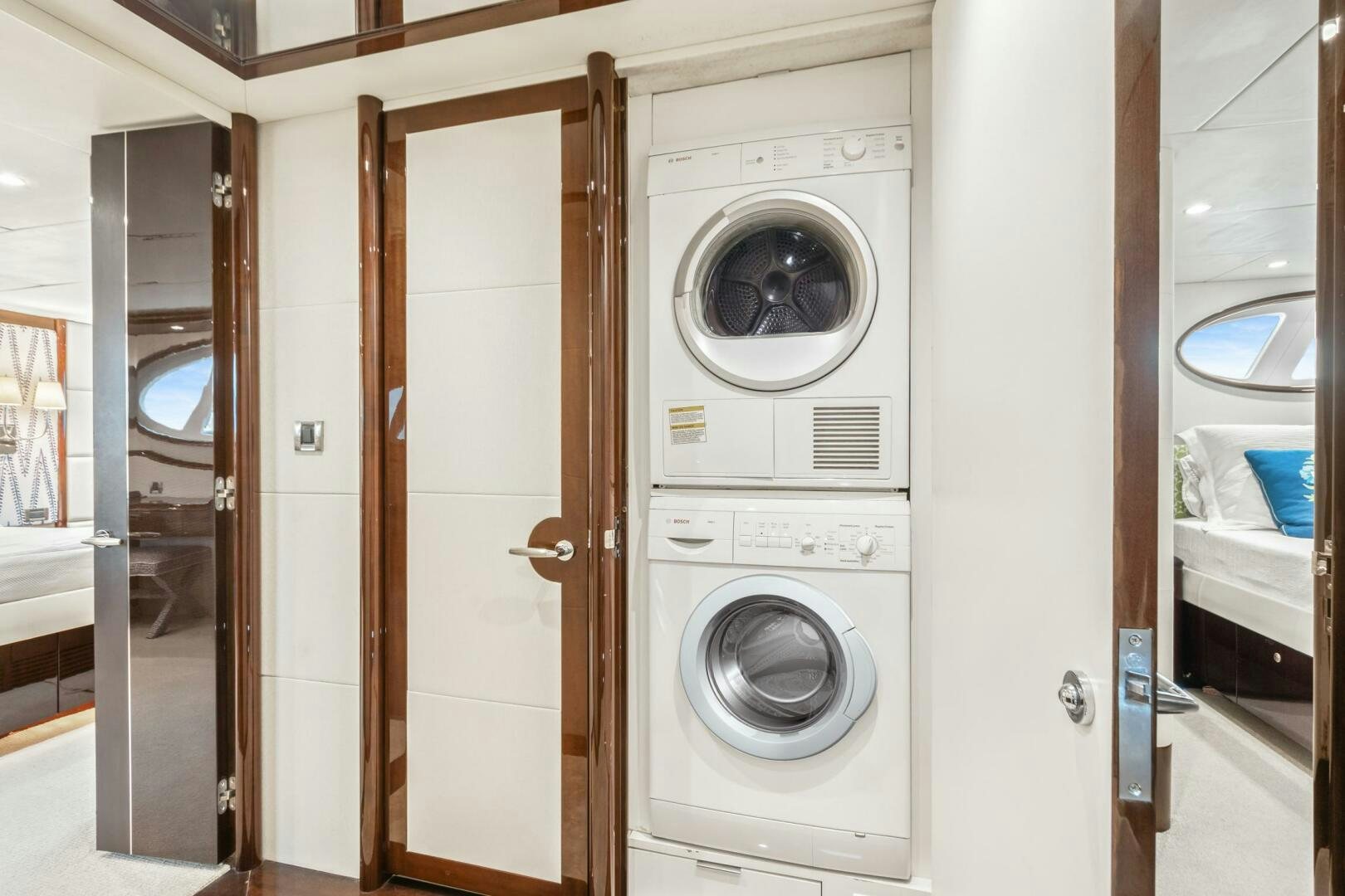a washer and dryer in a room aboard HIGH LIFE Yacht for Sale