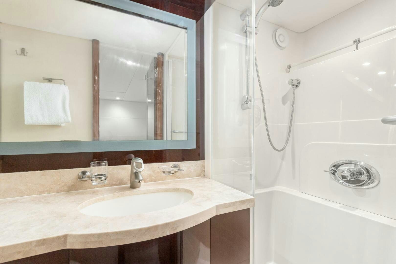 a bathroom with a sink and a shower aboard HIGH LIFE Yacht for Sale