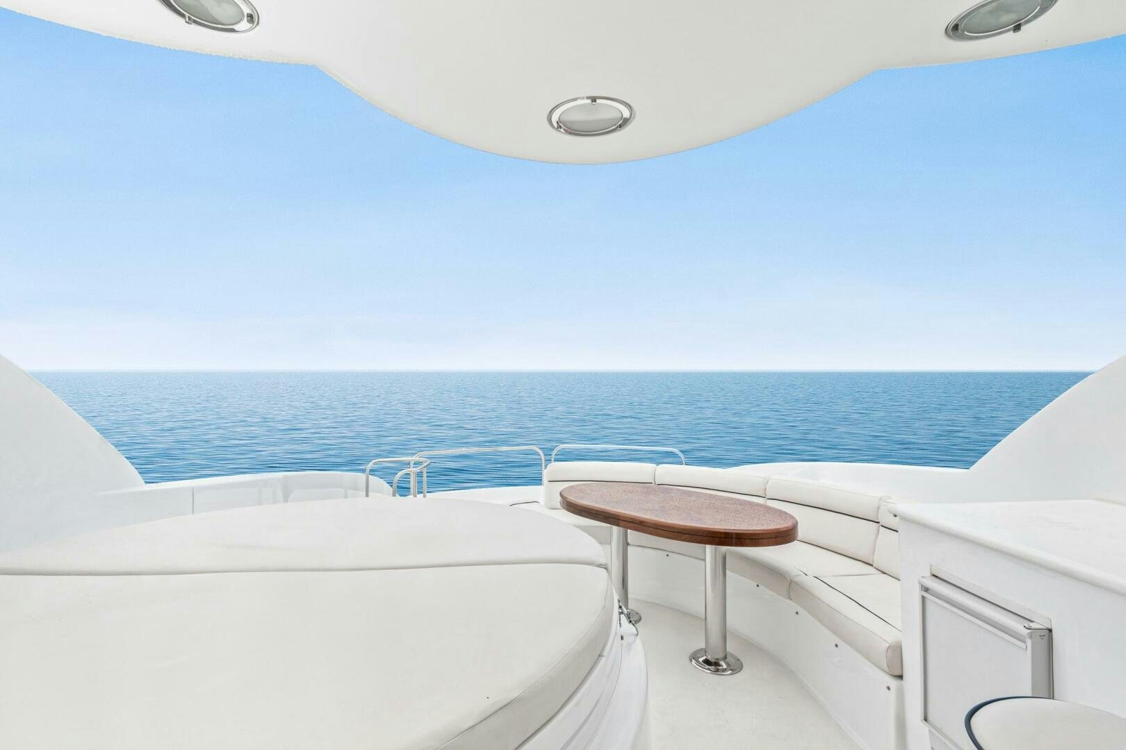 a table and chairs on a boat aboard HIGH LIFE Yacht for Sale