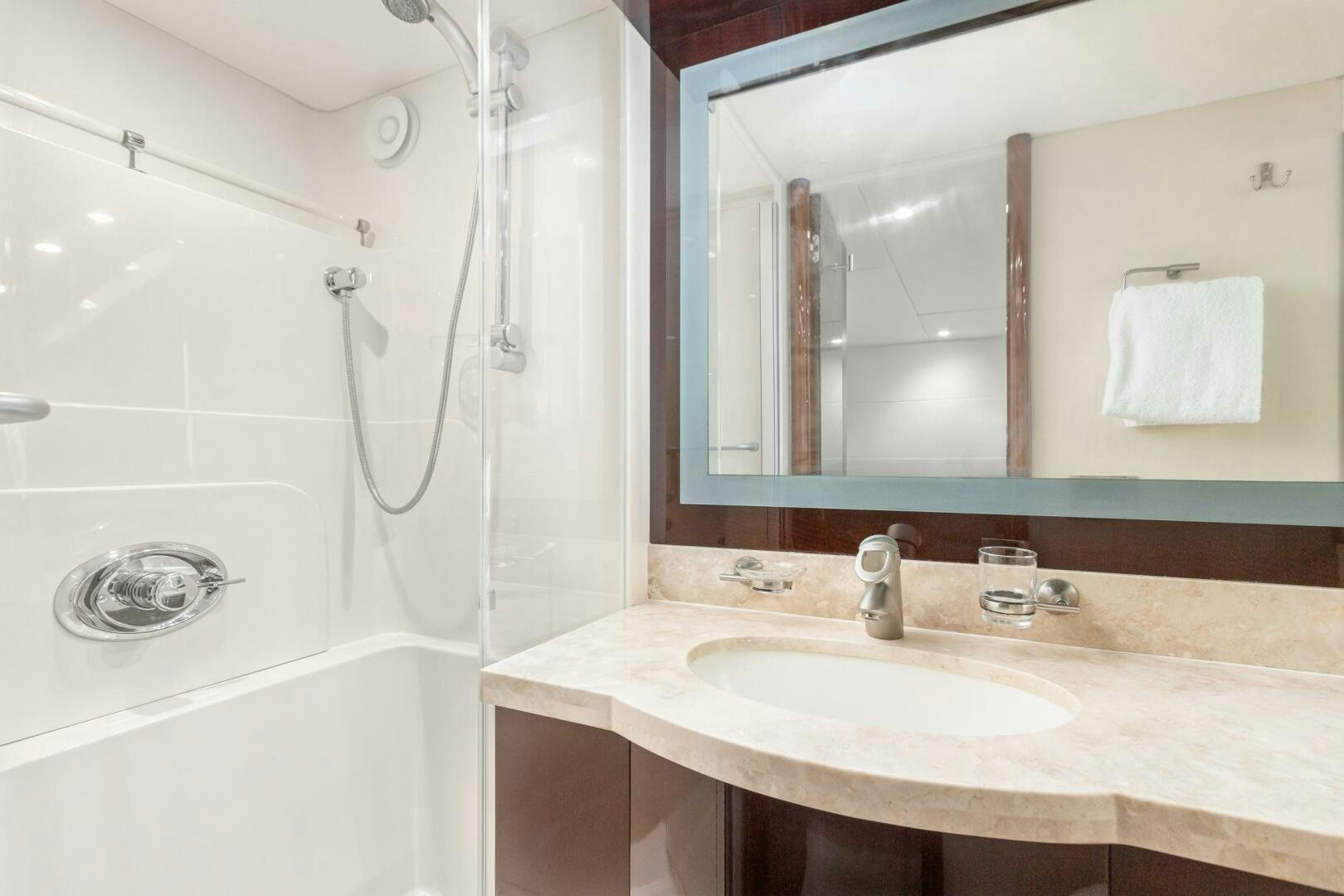 a bathroom with a sink and shower aboard HIGH LIFE Yacht for Sale