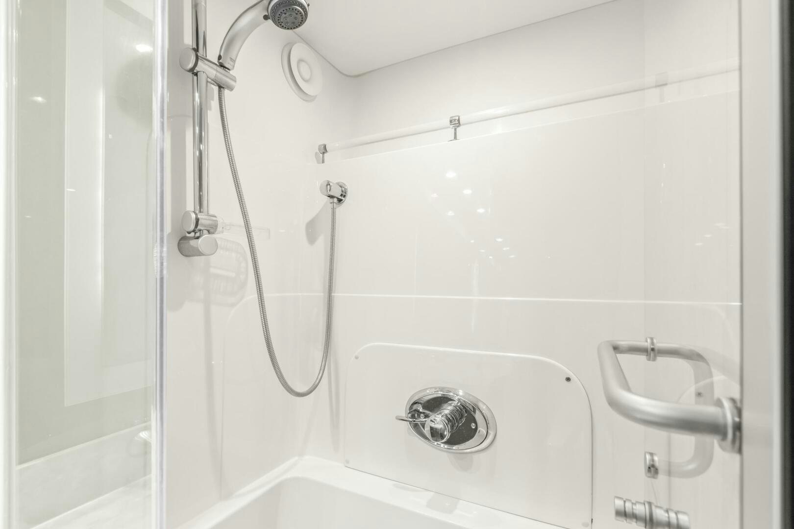 a white bathtub with a shower head and a shower head aboard HIGH LIFE Yacht for Sale