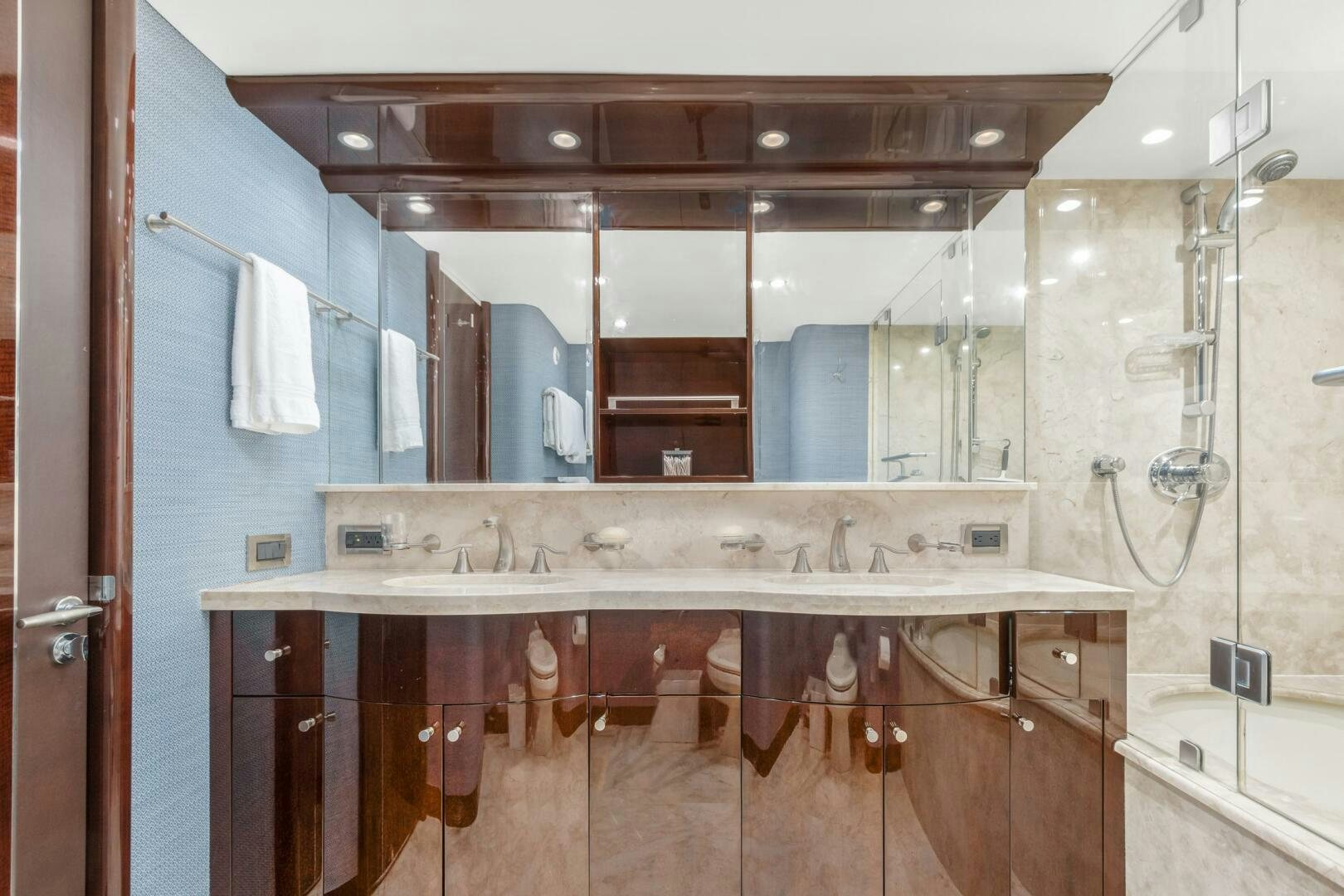 a bathroom with a sink and cabinets aboard HIGH LIFE Yacht for Sale