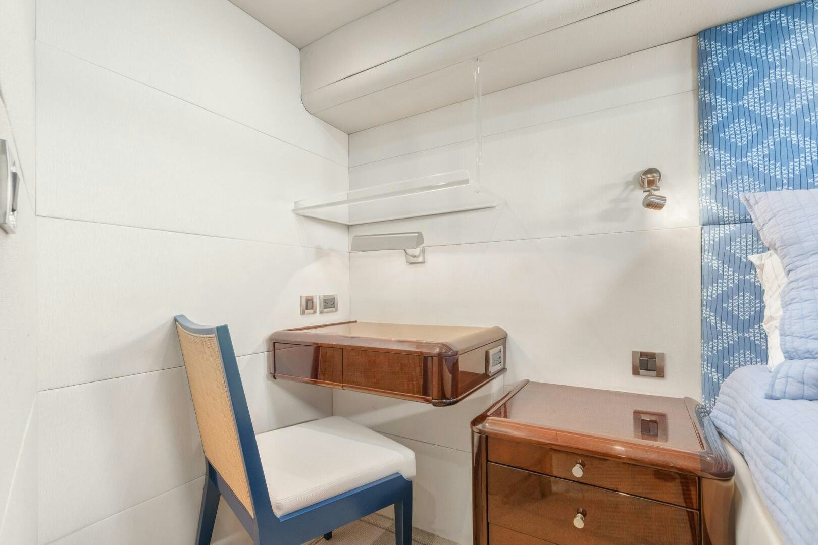a small room with a desk and a chair aboard HIGH LIFE Yacht for Sale