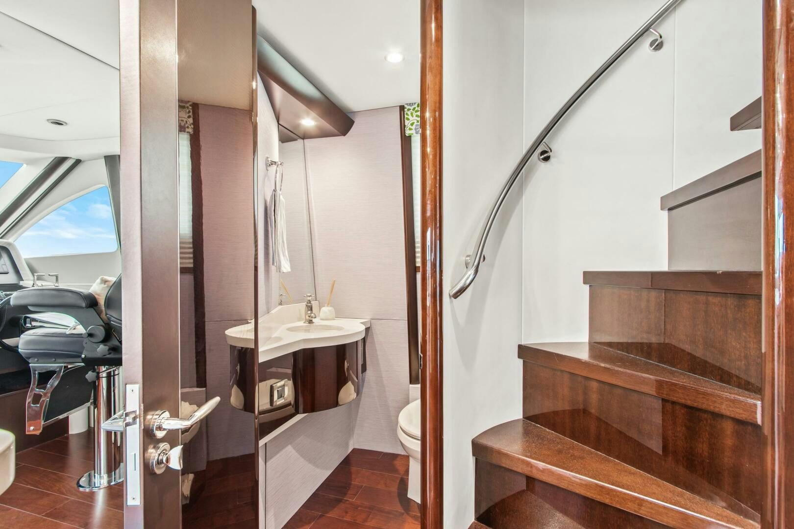 a bathroom with a sink and a toilet aboard HIGH LIFE Yacht for Sale