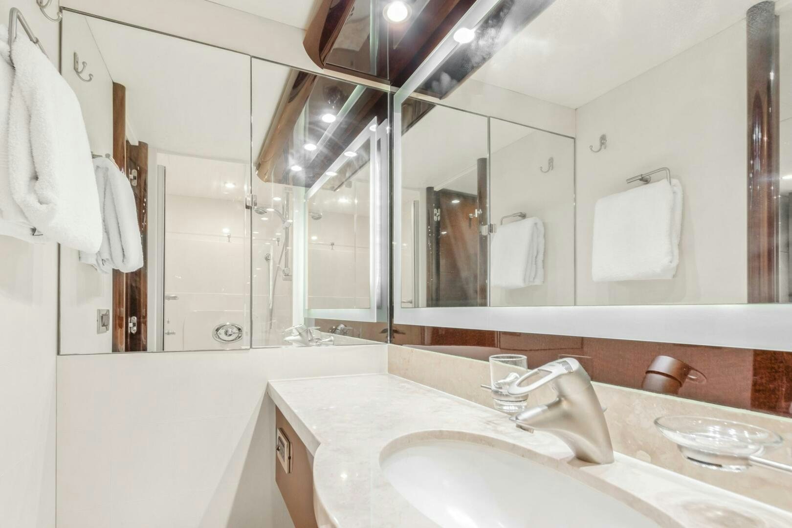 a bathroom with a large mirror aboard HIGH LIFE Yacht for Sale