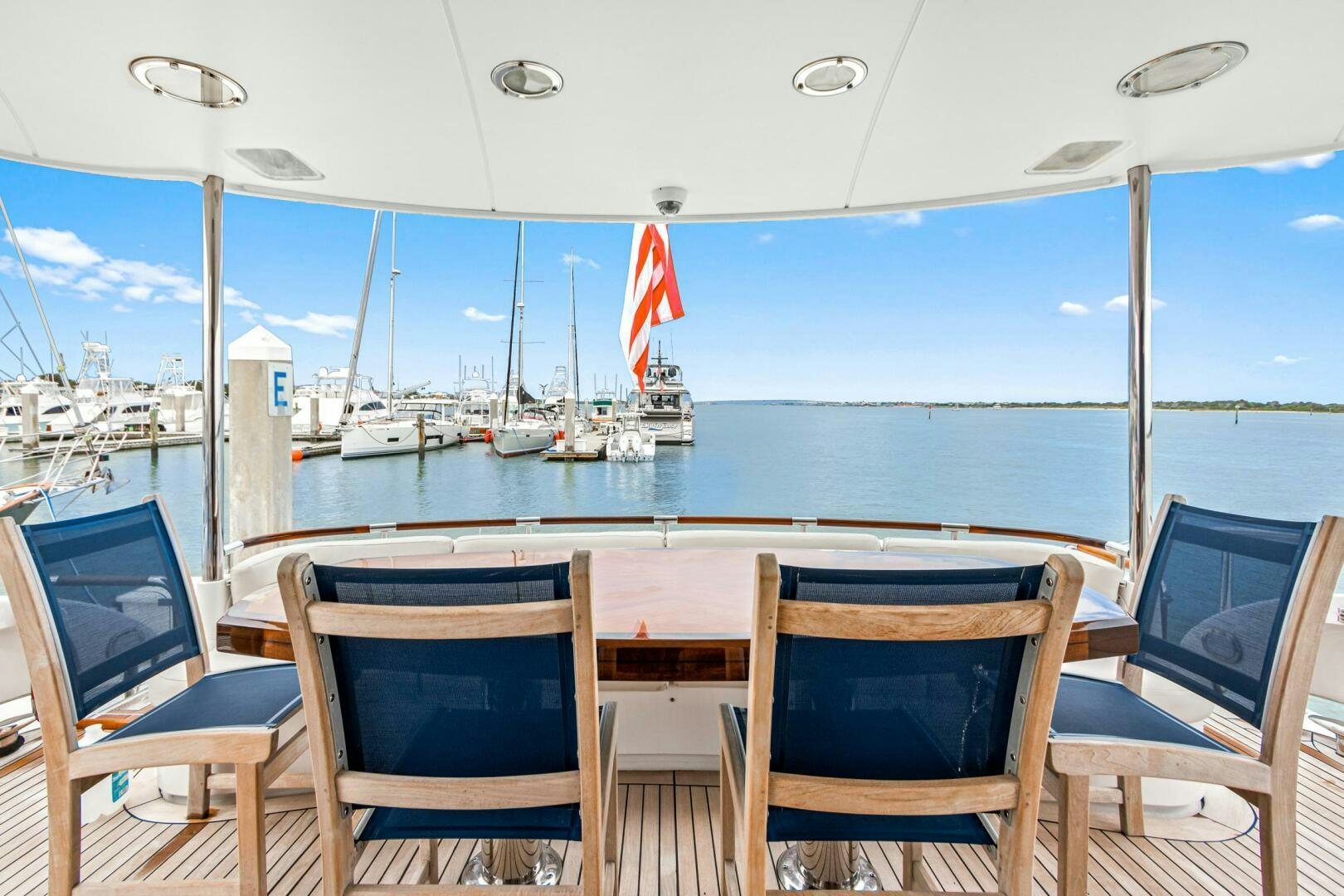 a table and chairs on a boat aboard HIGH LIFE Yacht for Sale