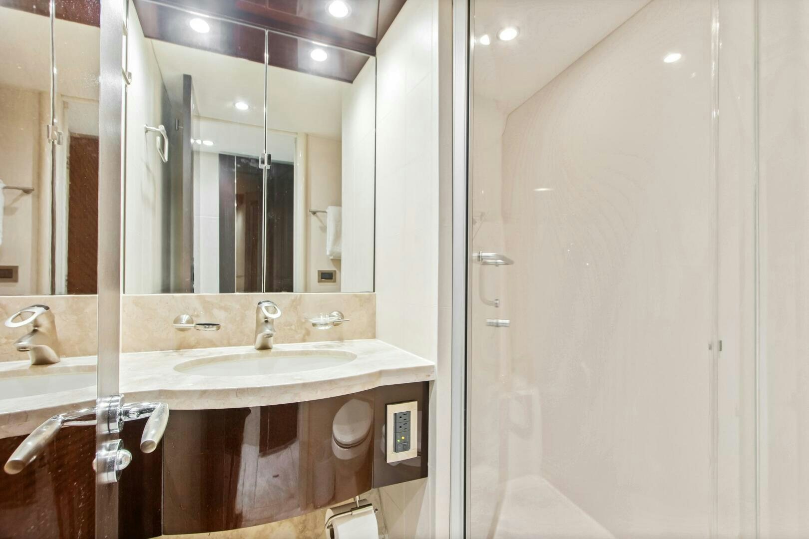a bathroom with a large mirror aboard HIGH LIFE Yacht for Sale