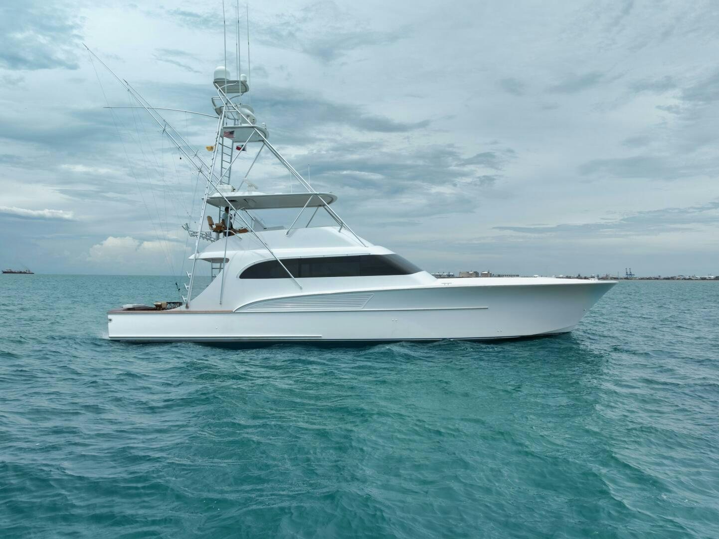 a white yacht in the water aboard LET IT RIDE Yacht for Sale