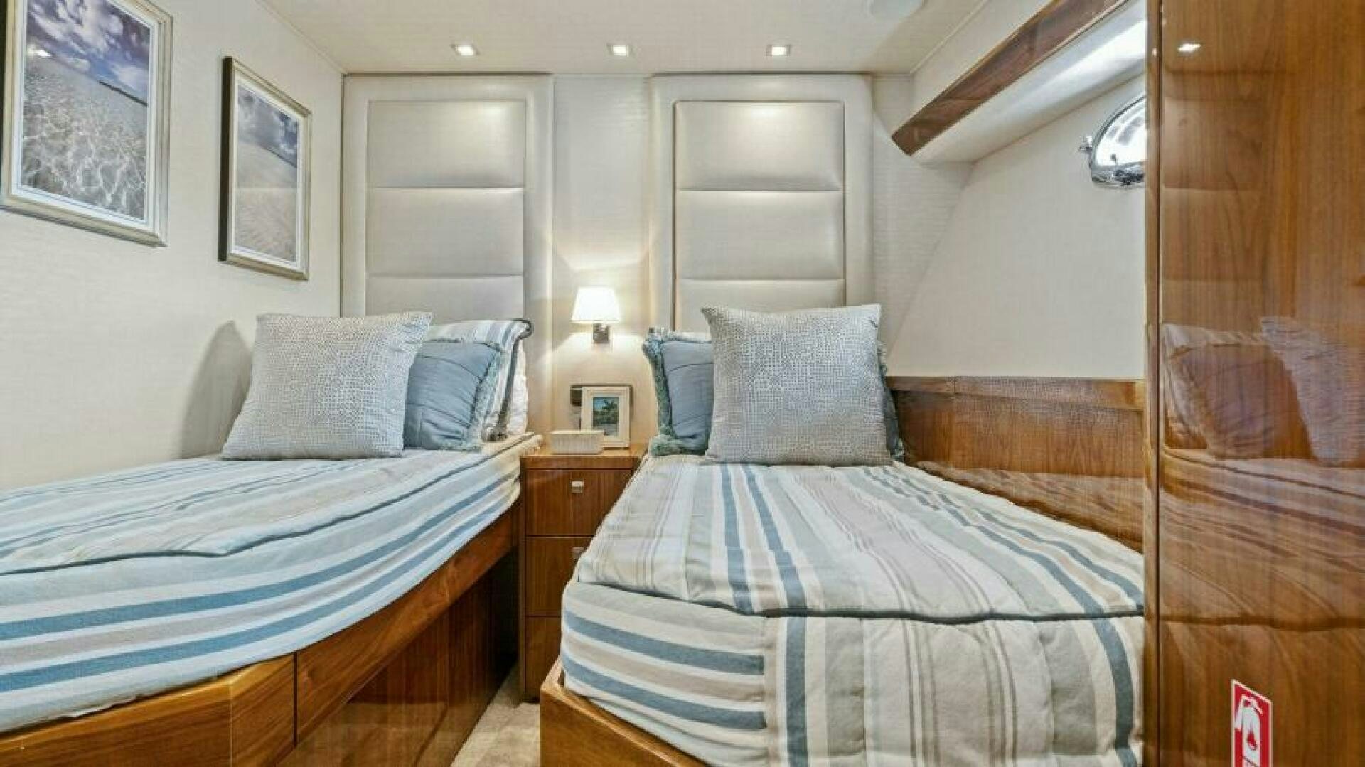 a couple of beds in a hotel room aboard AMORE Yacht for Sale