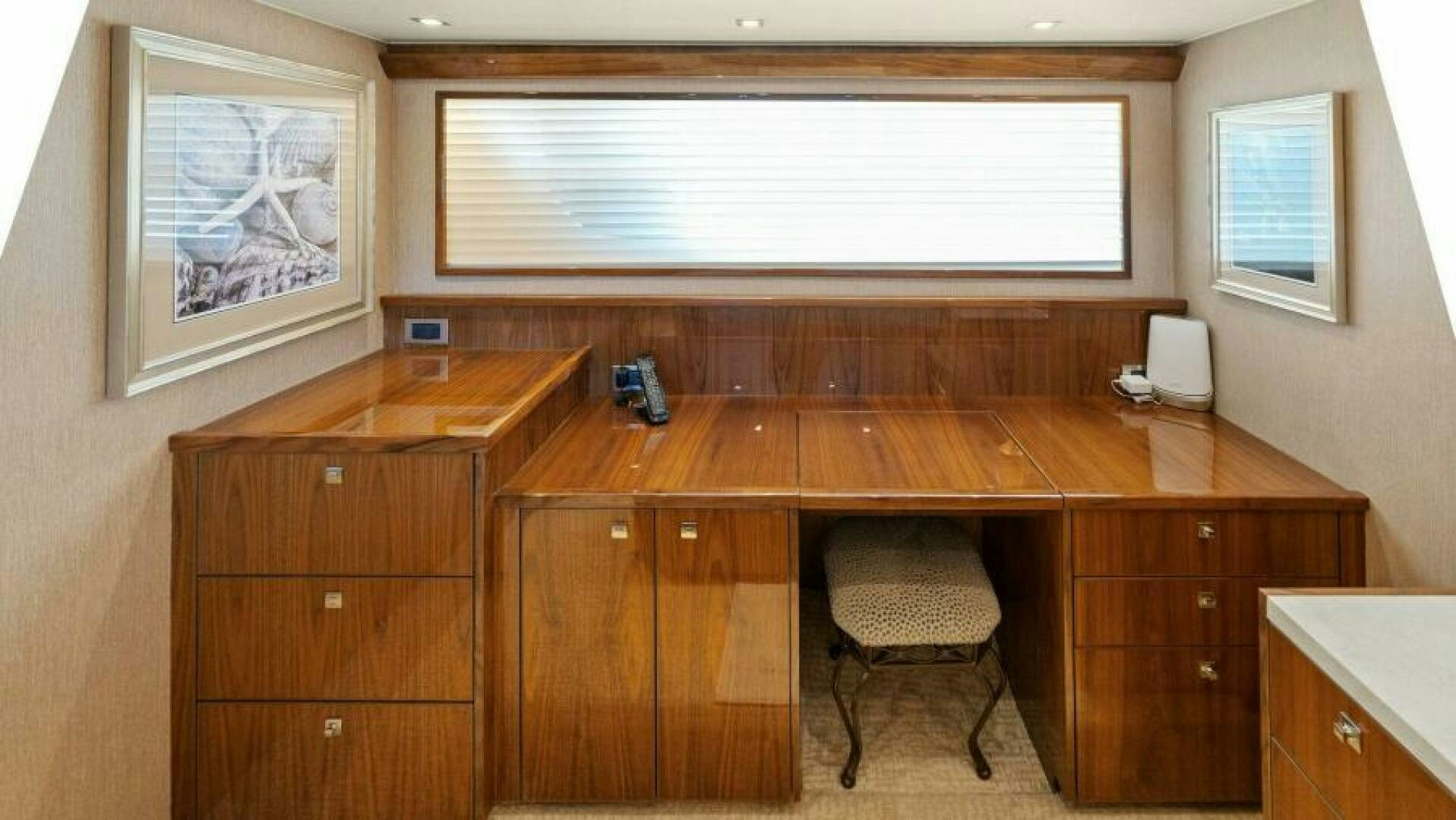 a room with a desk and a chair aboard AMORE Yacht for Sale