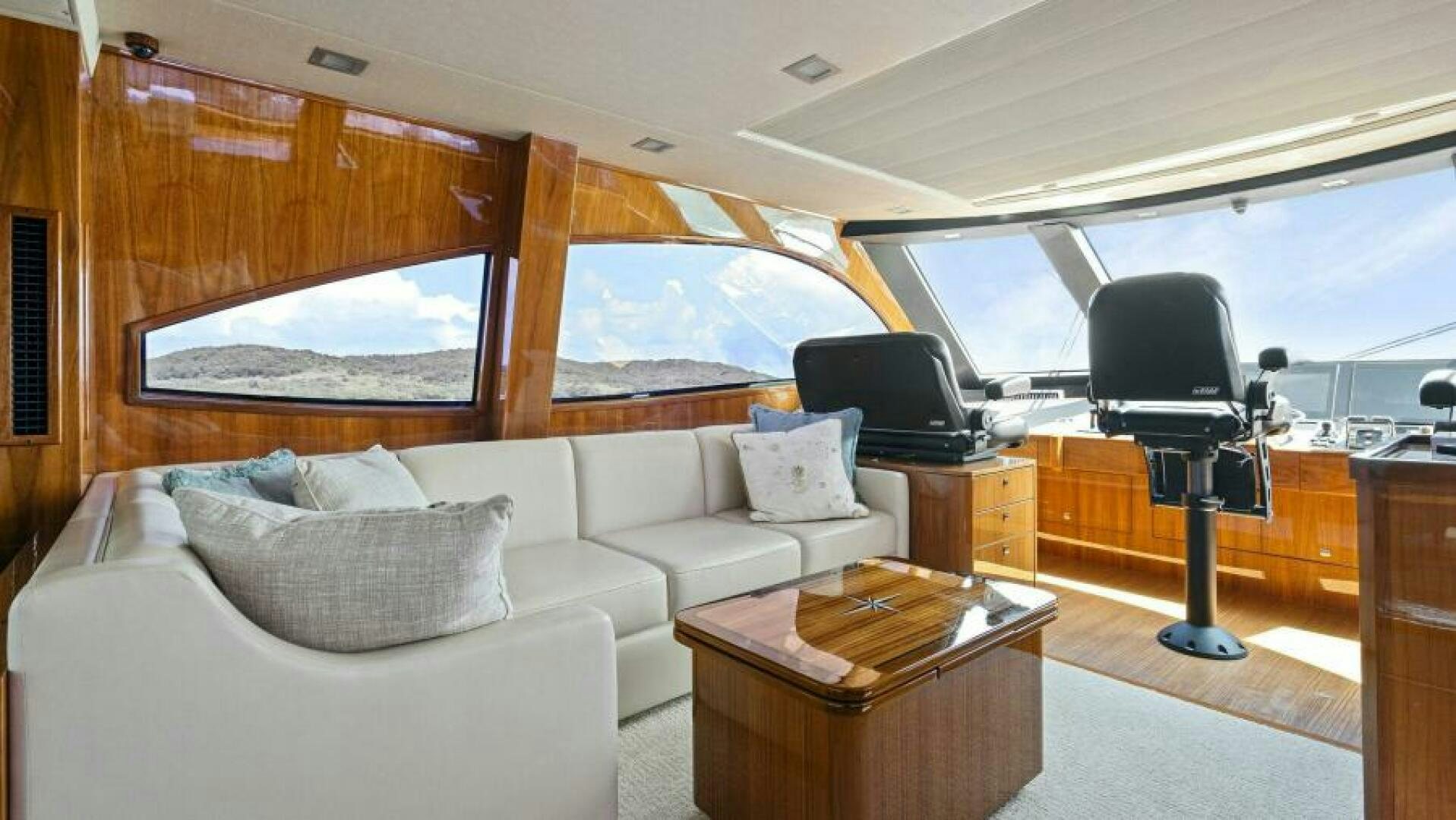 a living room with a couch and a table aboard AMORE Yacht for Sale
