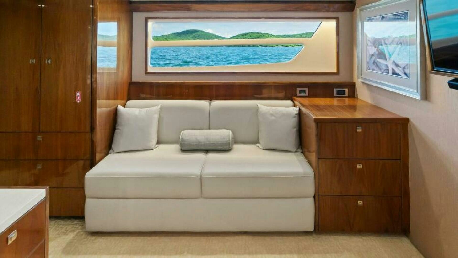 a couch in a room aboard AMORE Yacht for Sale