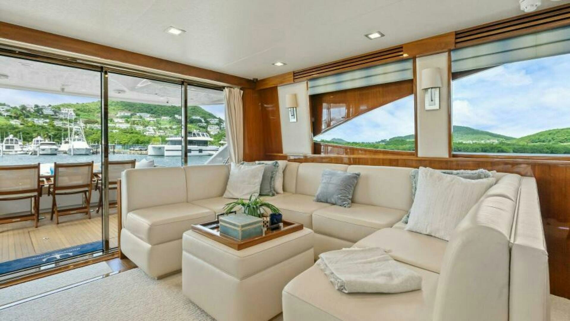 a living room with a large window aboard AMORE Yacht for Sale