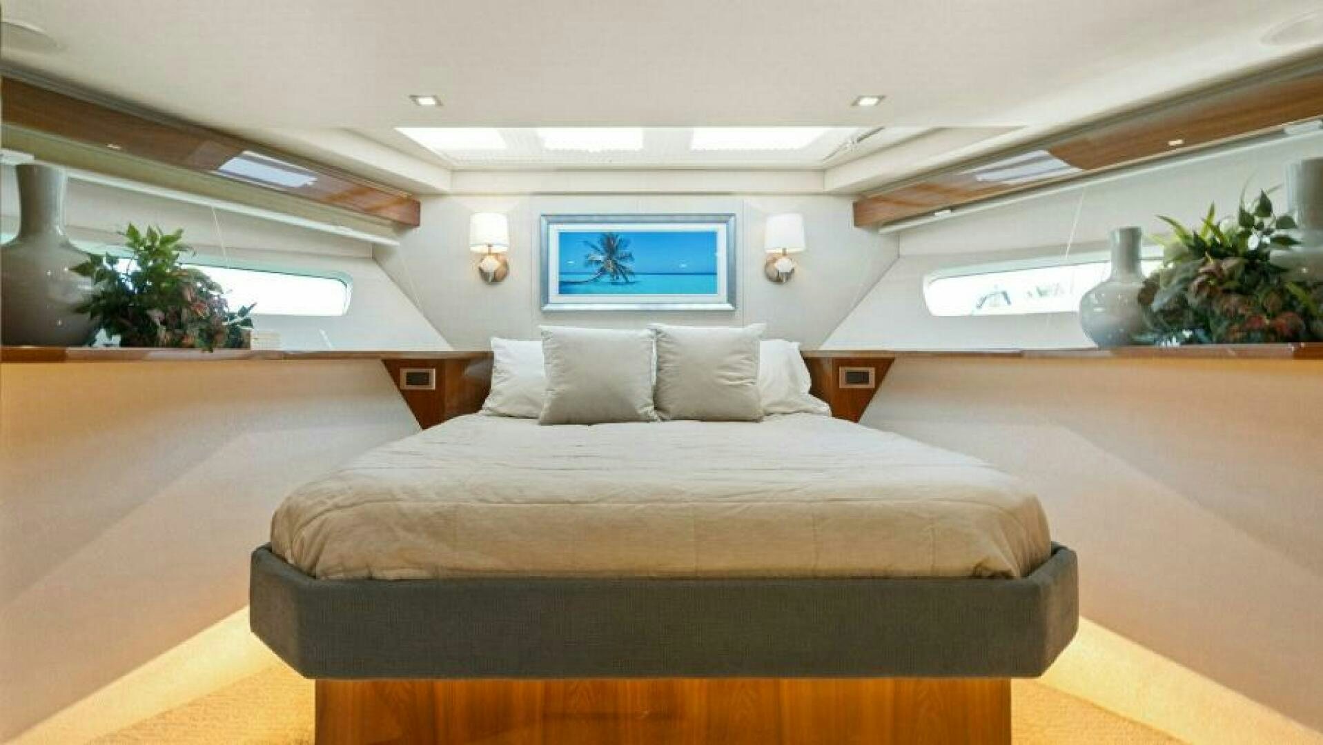 a large bed in a room aboard AMORE Yacht for Sale