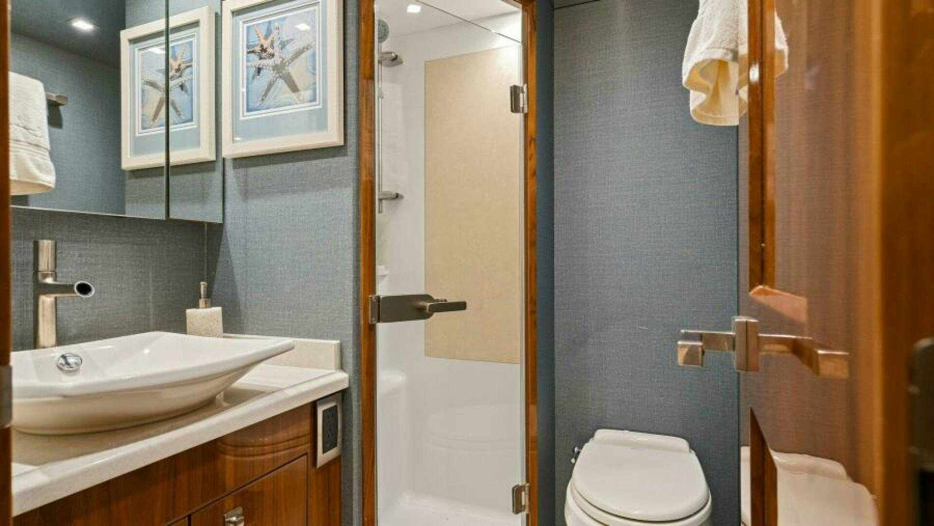 a bathroom with a sink and toilet aboard AMORE Yacht for Sale