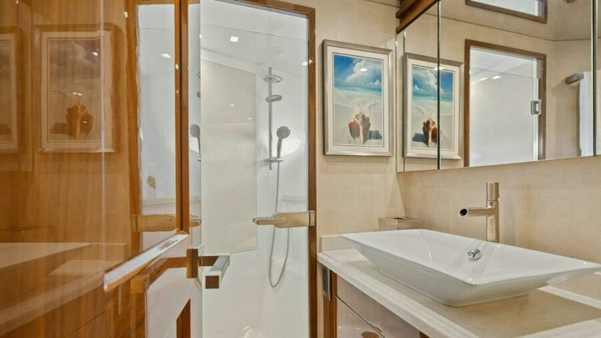 a bathroom with a bathtub and sink aboard AMORE Yacht for Sale