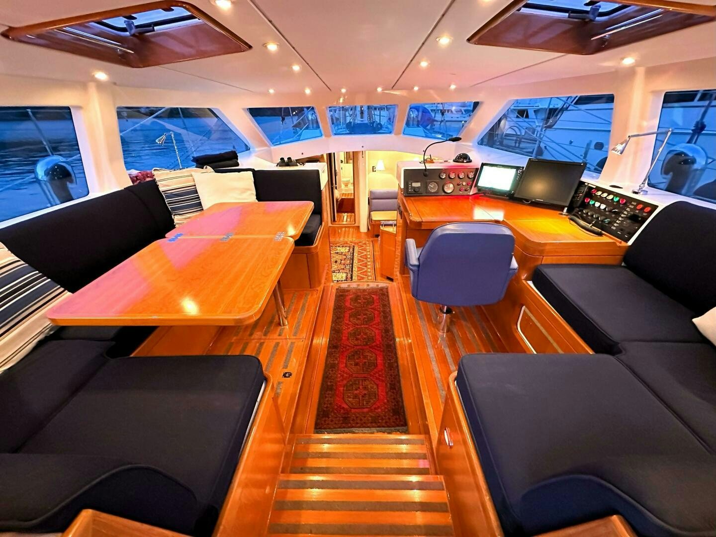 a room with a table and chairs aboard LEONORE Yacht for Sale