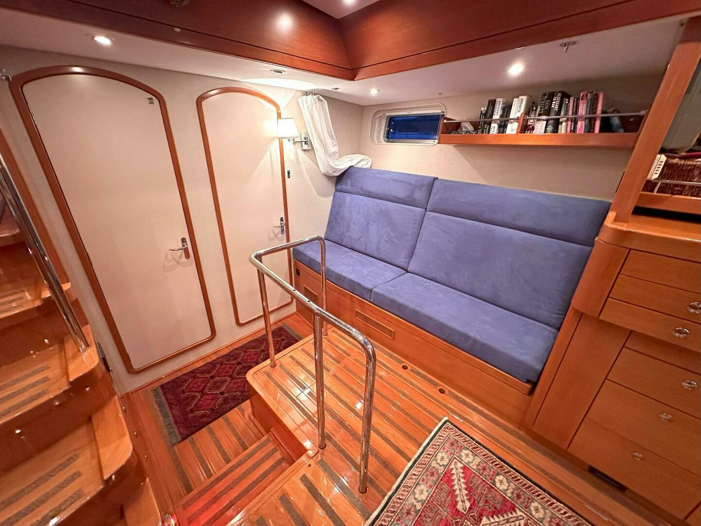 a bed and a chair in a room aboard LEONORE Yacht for Sale