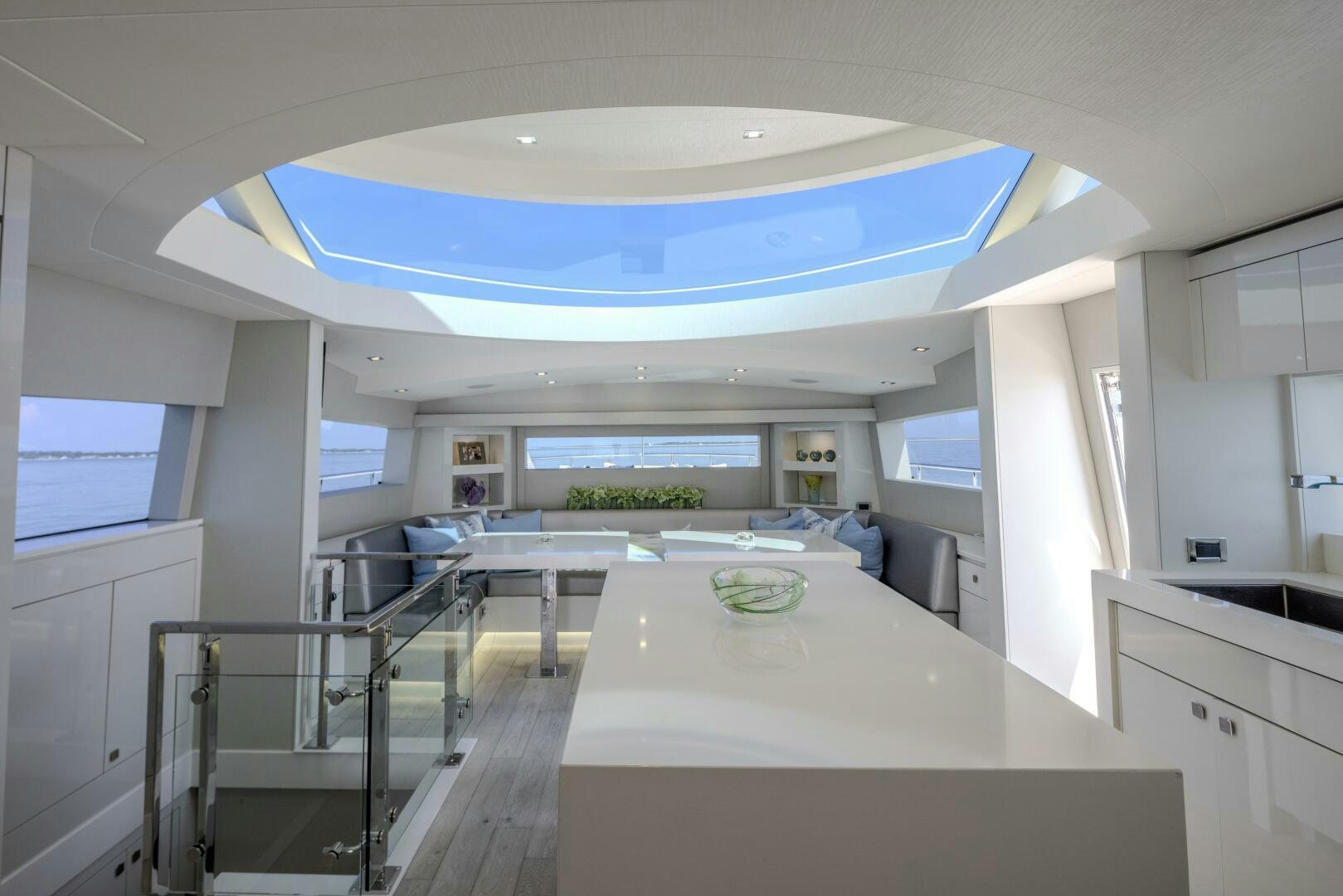 a large kitchen with white cabinets aboard IMAGINE Yacht for Sale