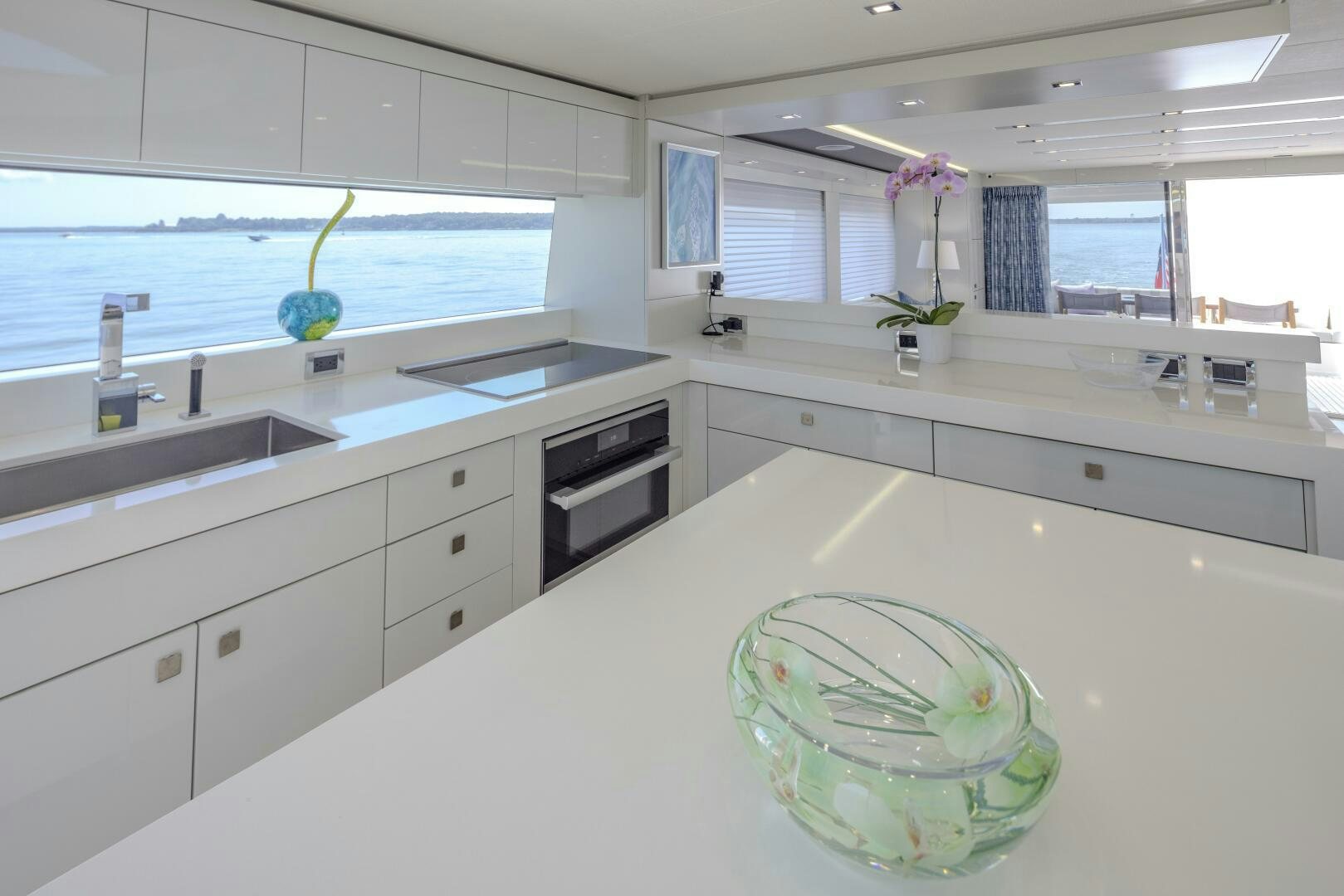 a kitchen with a large island aboard IMAGINE Yacht for Sale
