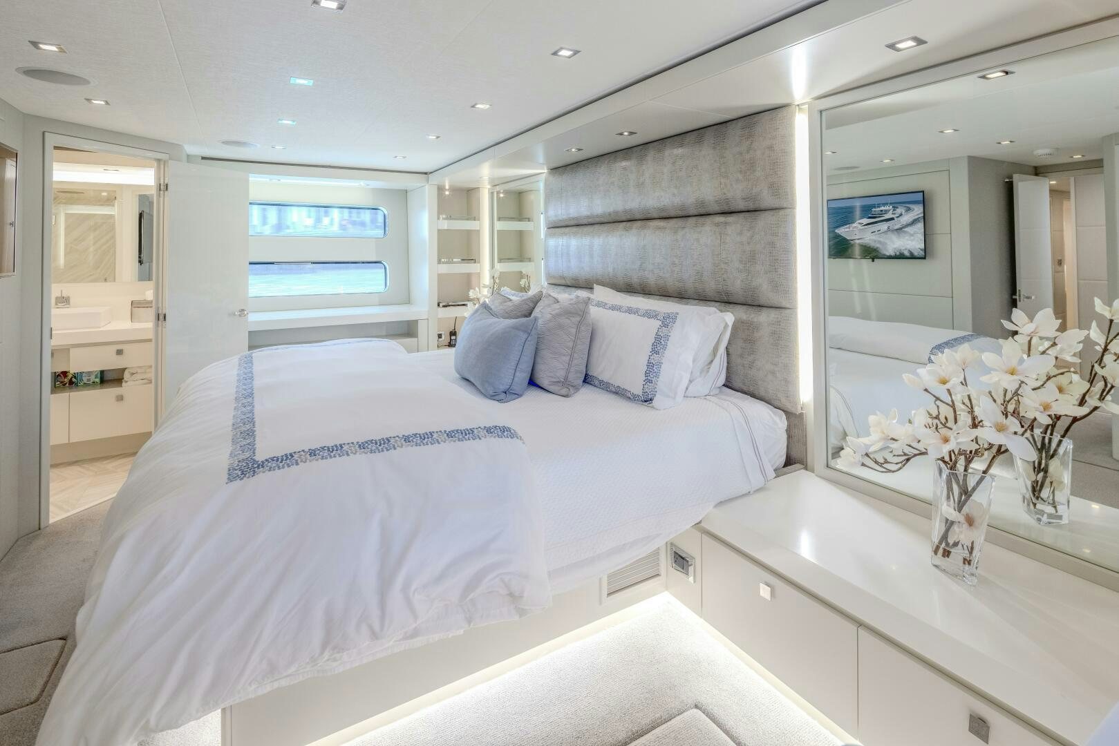 a bedroom with a large bed aboard IMAGINE Yacht for Sale