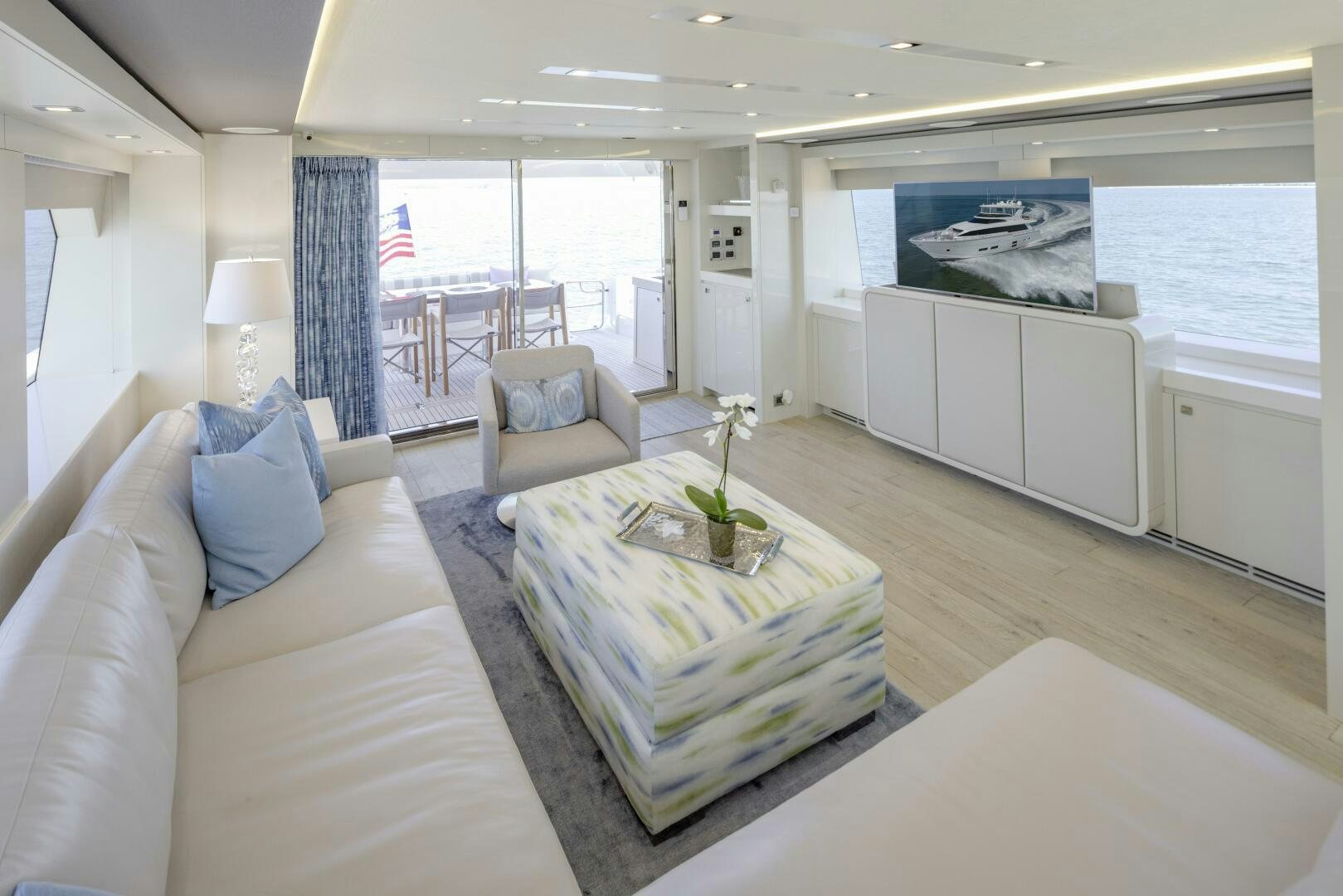 a living room with a large window aboard IMAGINE Yacht for Sale