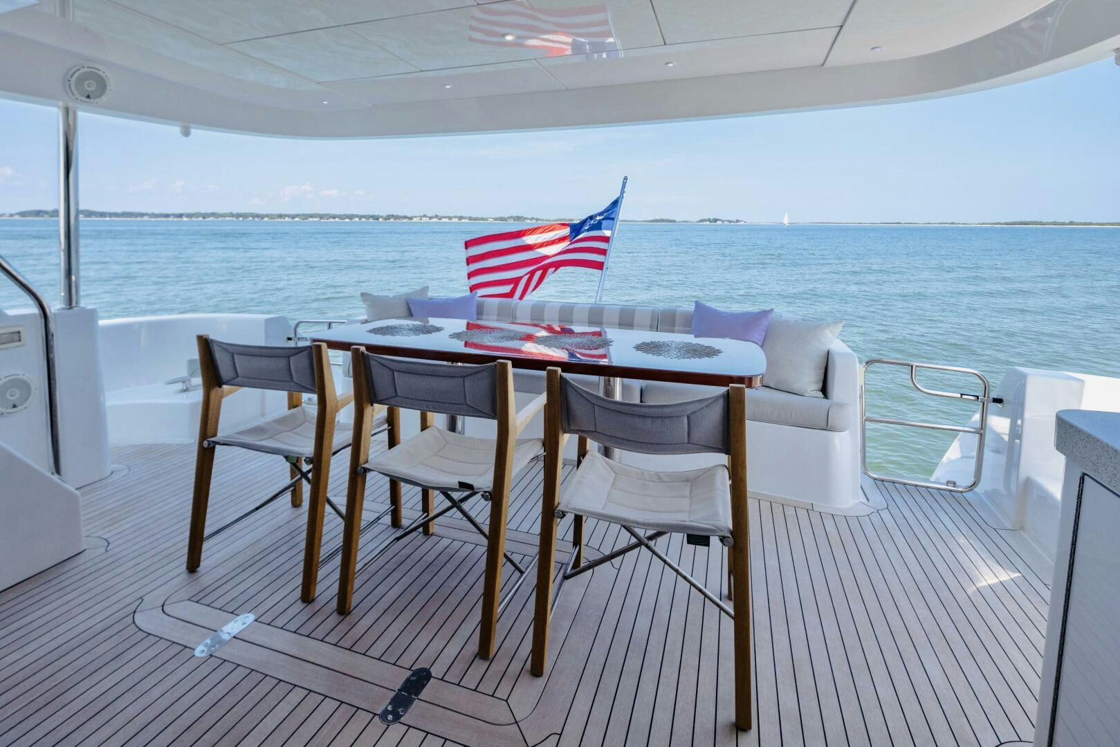 a table with chairs on it aboard IMAGINE Yacht for Sale