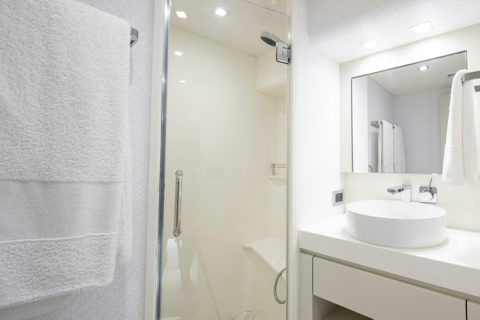 a bathroom with a sink and a shower aboard IMAGINE Yacht for Sale
