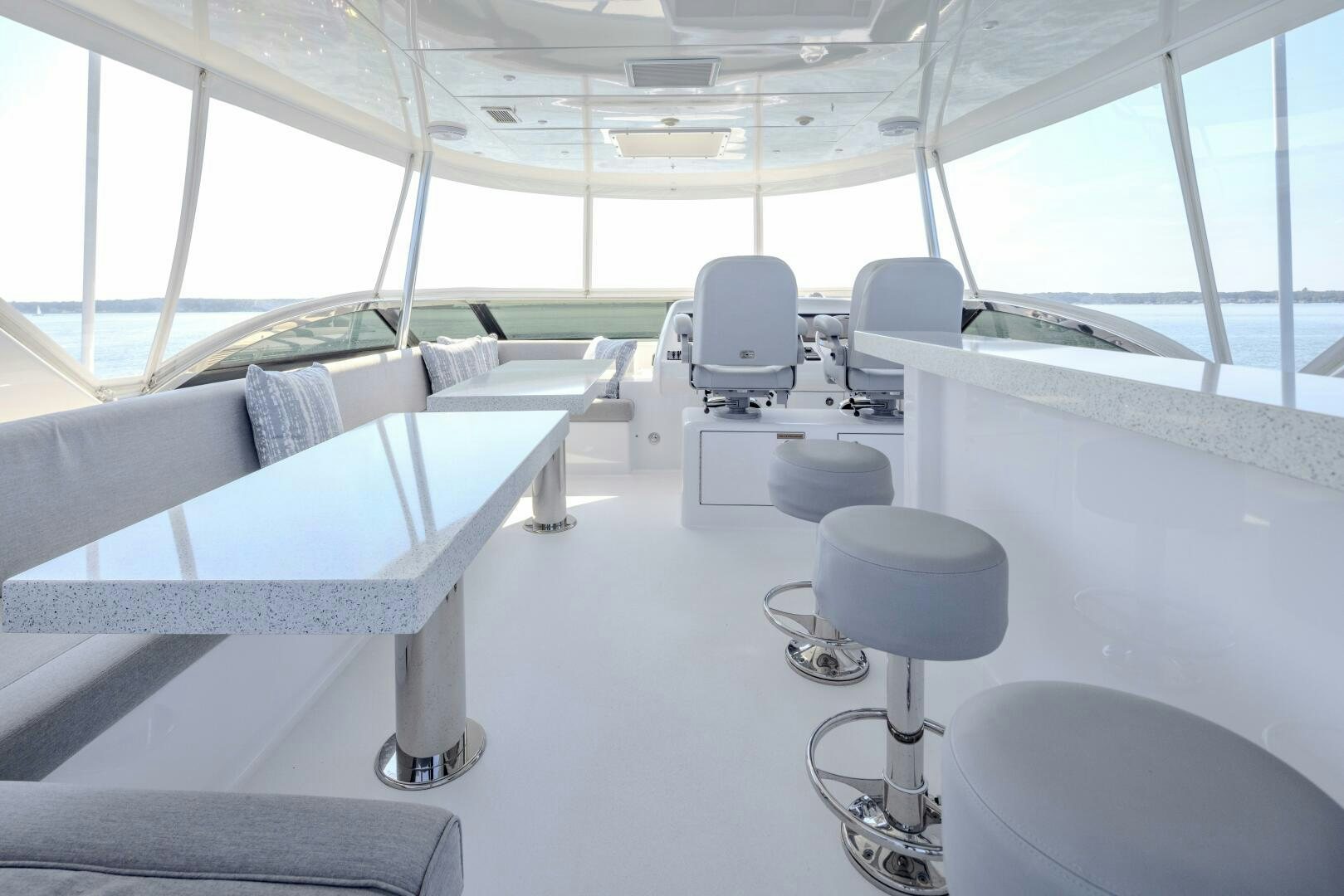 a room with chairs and tables aboard IMAGINE Yacht for Sale