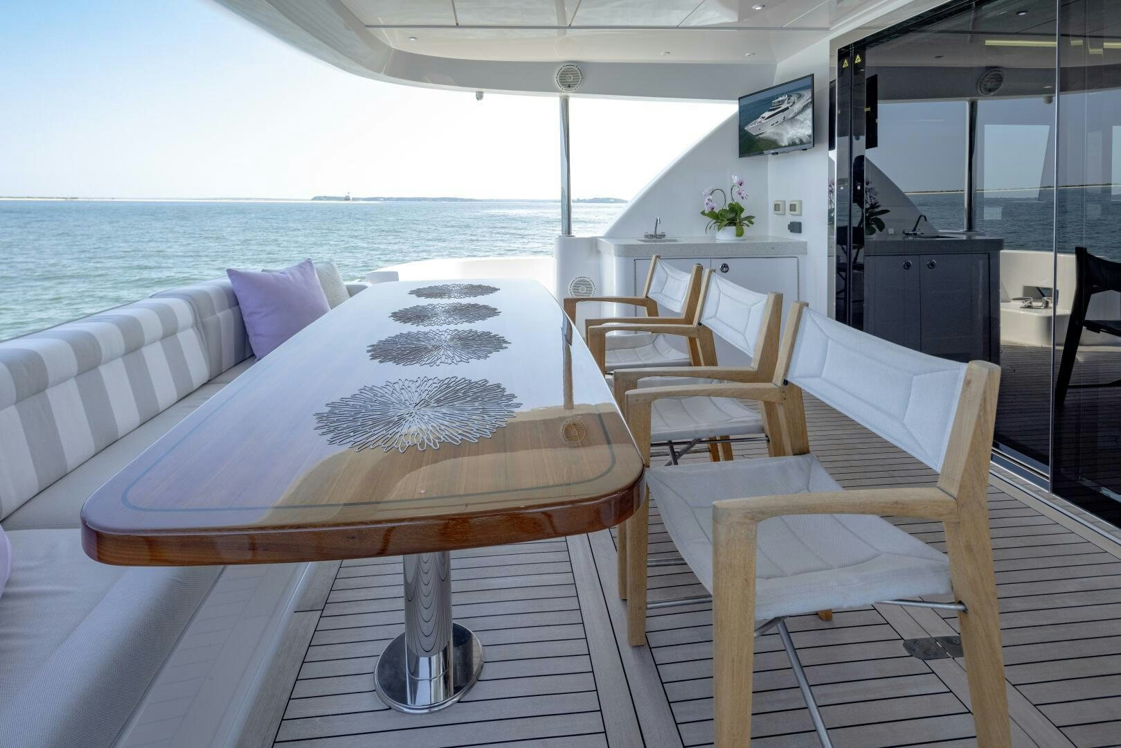 a table and chairs on a boat aboard IMAGINE Yacht for Sale