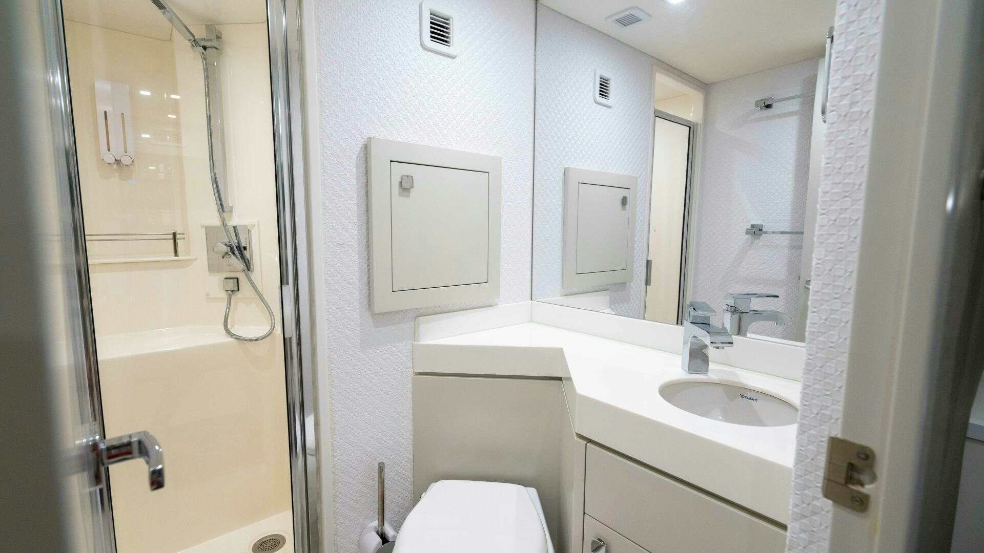 a bathroom with a sink toilet and a shower aboard IMAGINE Yacht for Sale