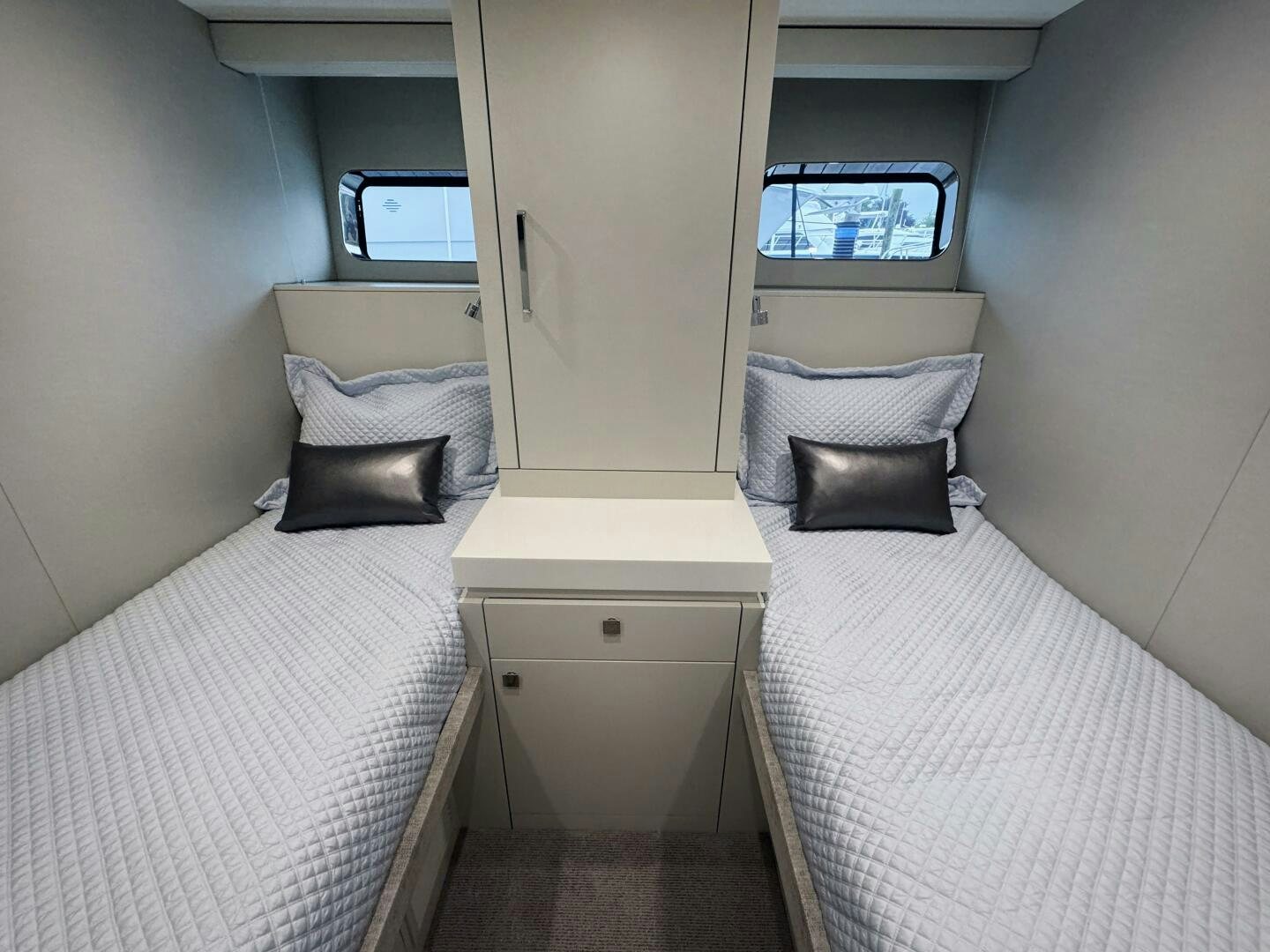 a room with two beds aboard IMAGINE Yacht for Sale