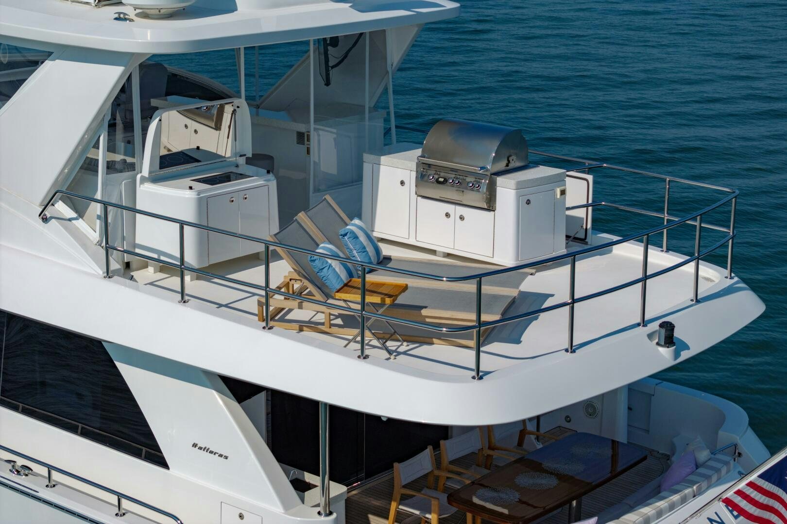 a boat with a couple of chairs on the deck aboard IMAGINE Yacht for Sale