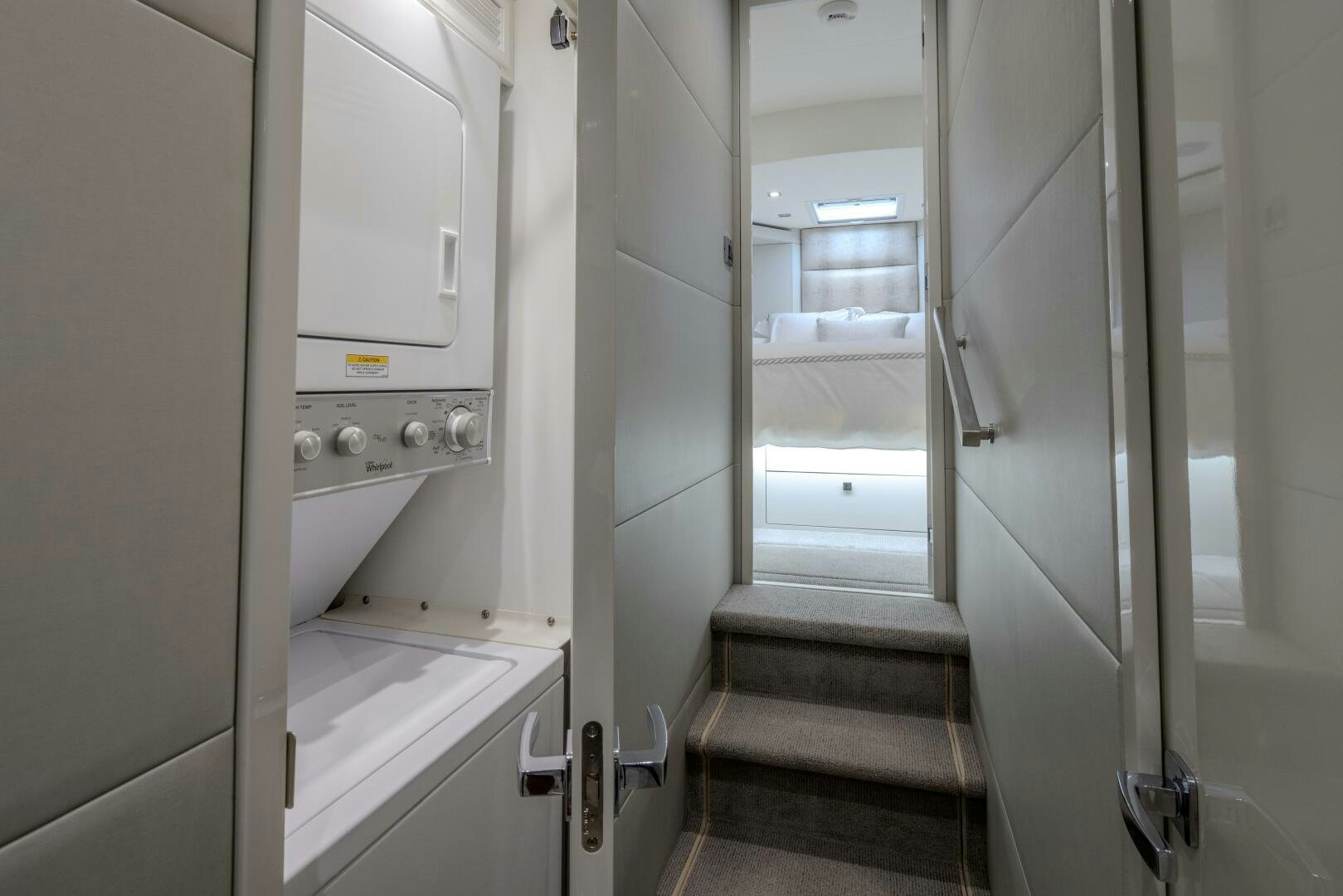 a hallway with a door and a window aboard IMAGINE Yacht for Sale