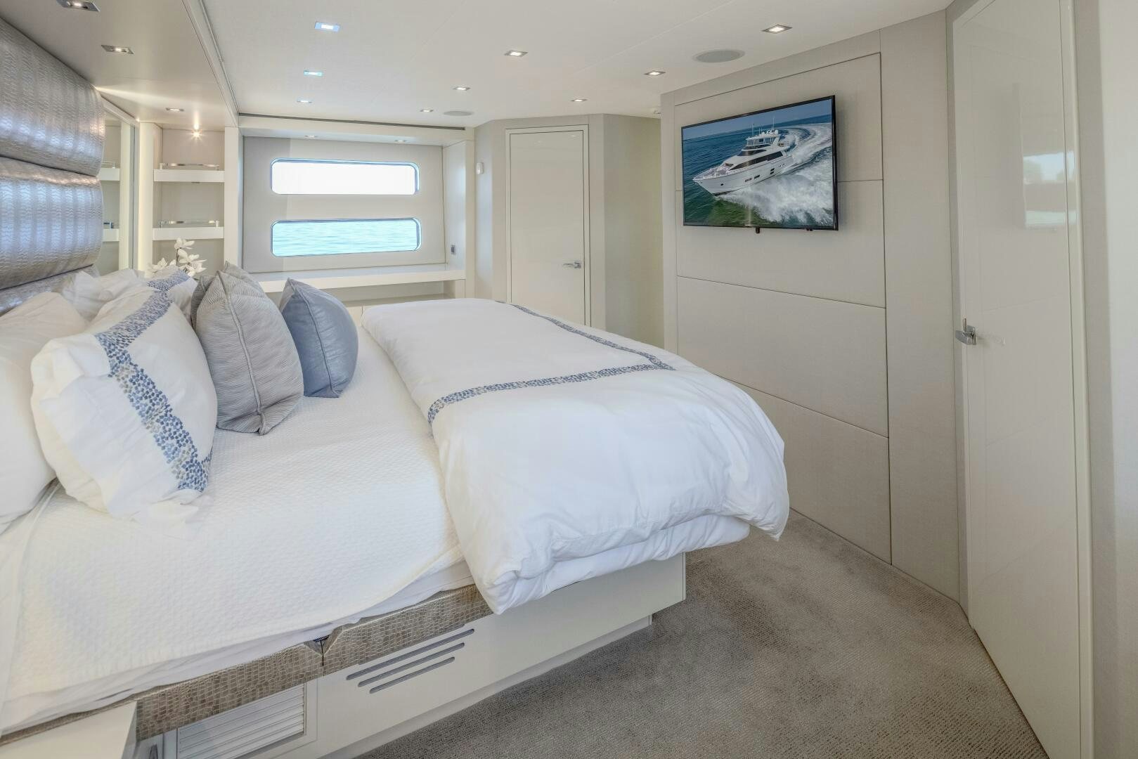a bedroom with a bed aboard IMAGINE Yacht for Sale