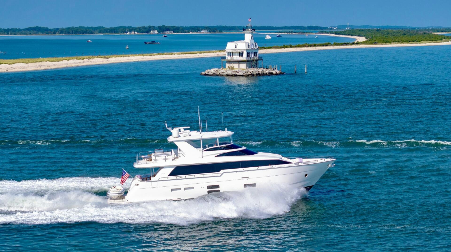 a couple of boats on the water aboard IMAGINE Yacht for Sale