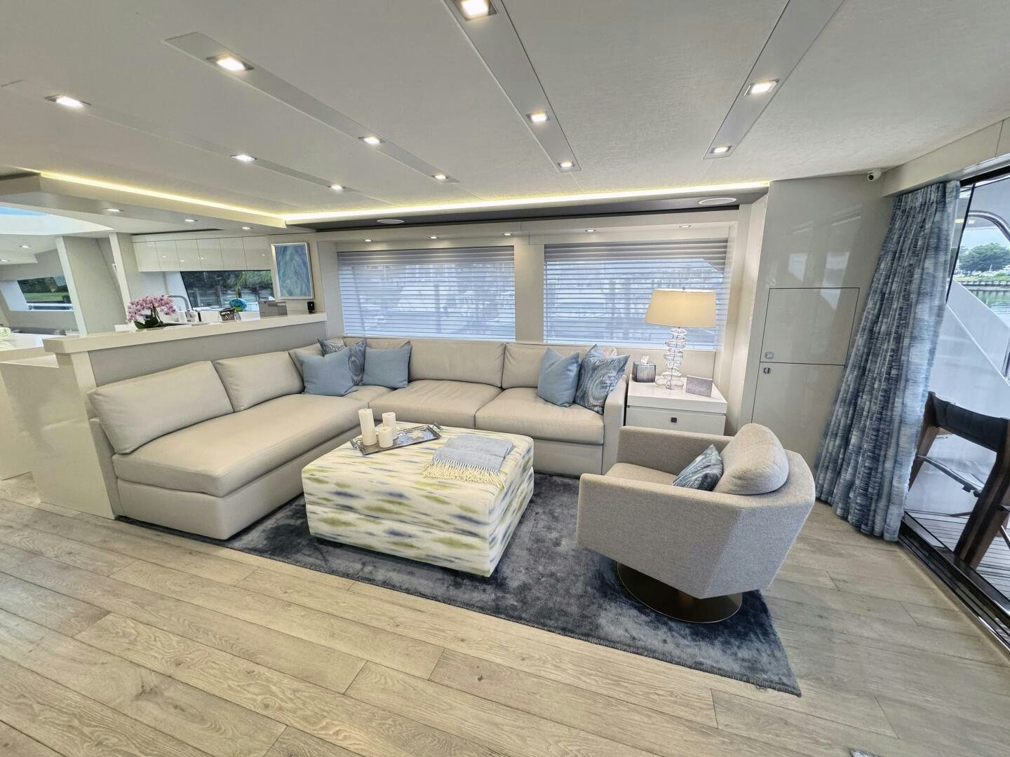 a living room with a couch and a table aboard IMAGINE Yacht for Sale