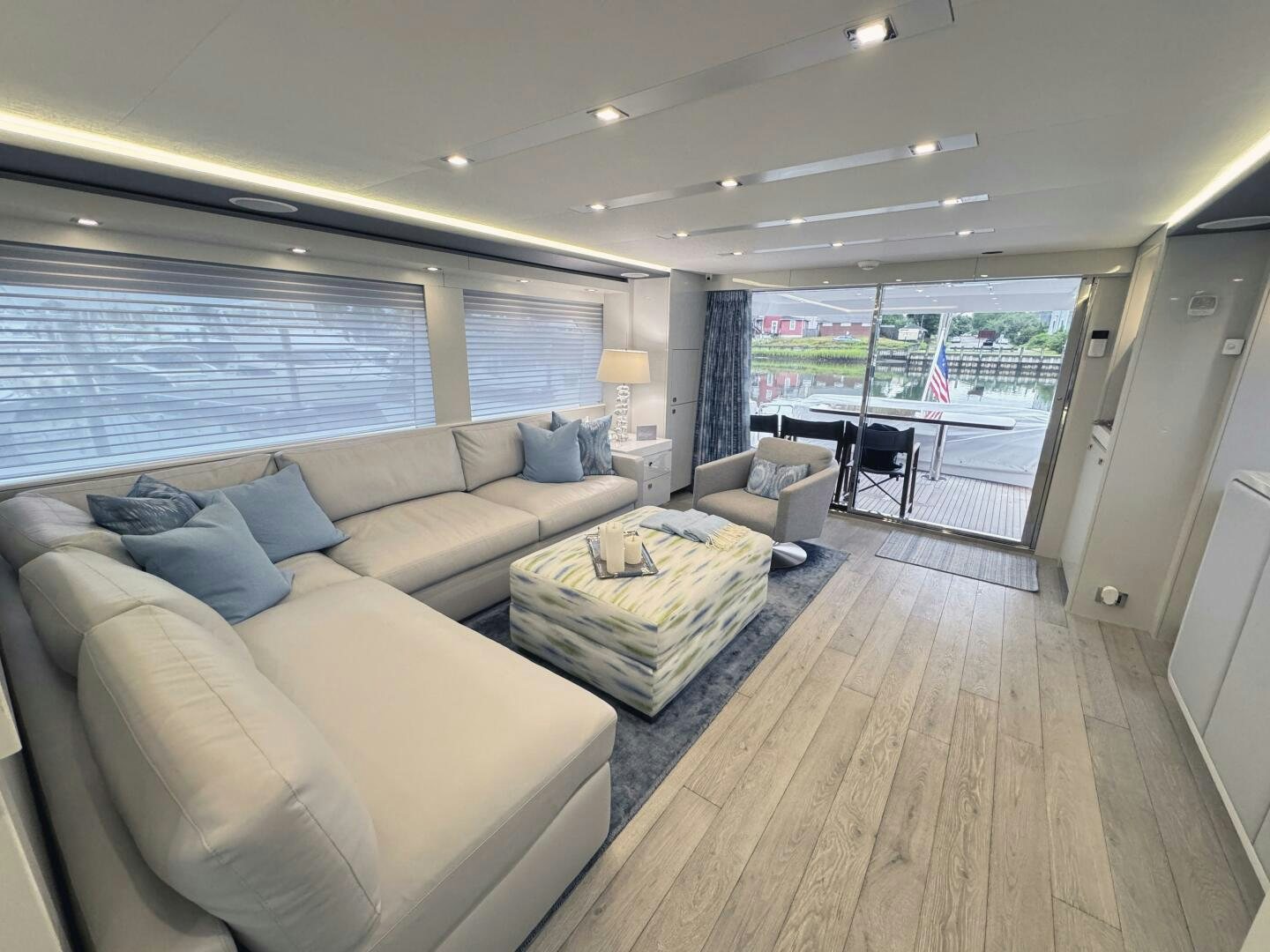 a living room with a large window aboard IMAGINE Yacht for Sale
