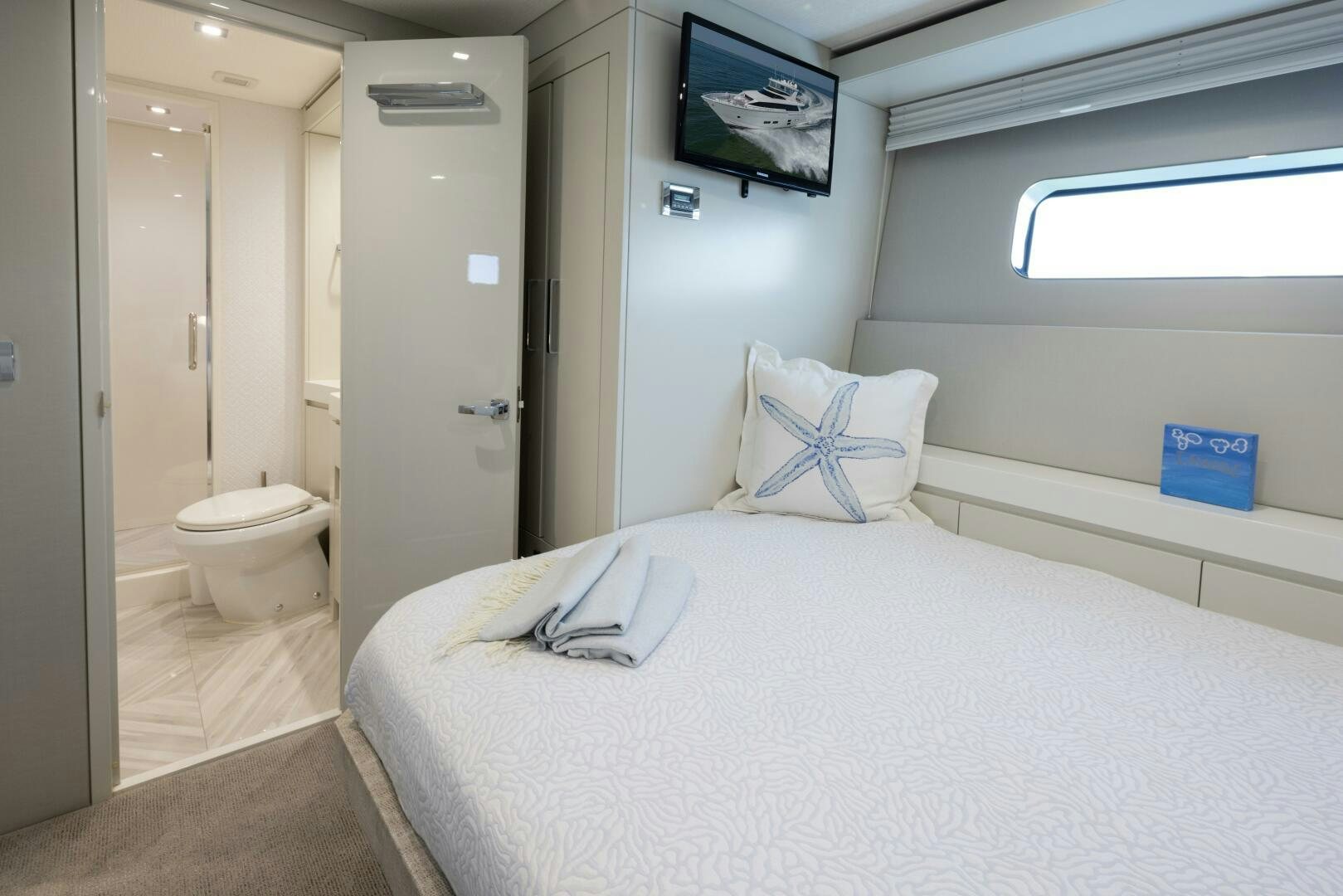 a bed in a room aboard IMAGINE Yacht for Sale