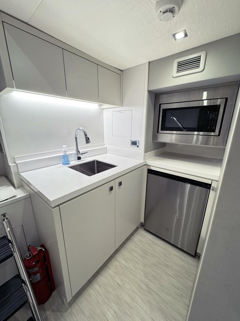 a kitchen with a microwave oven aboard IMAGINE Yacht for Sale