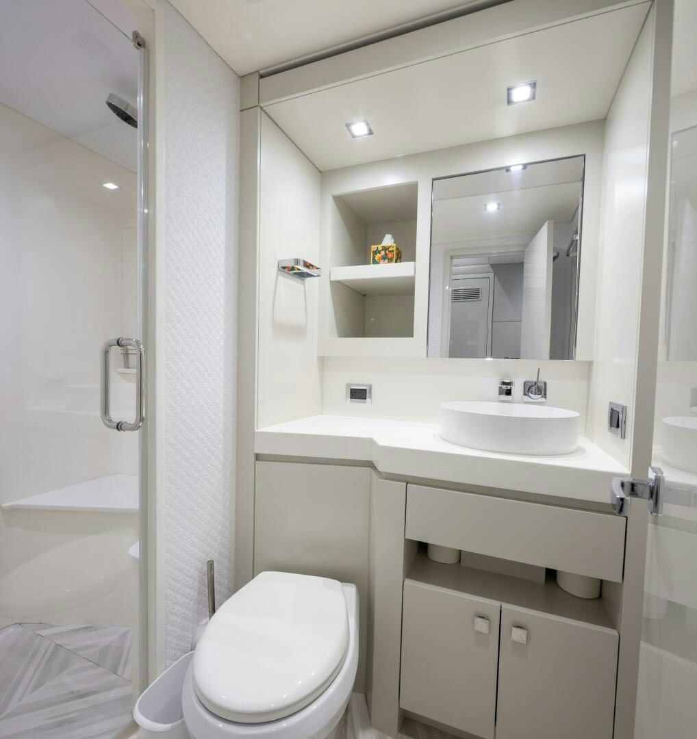 a bathroom with a sink toilet and a shower aboard IMAGINE Yacht for Sale