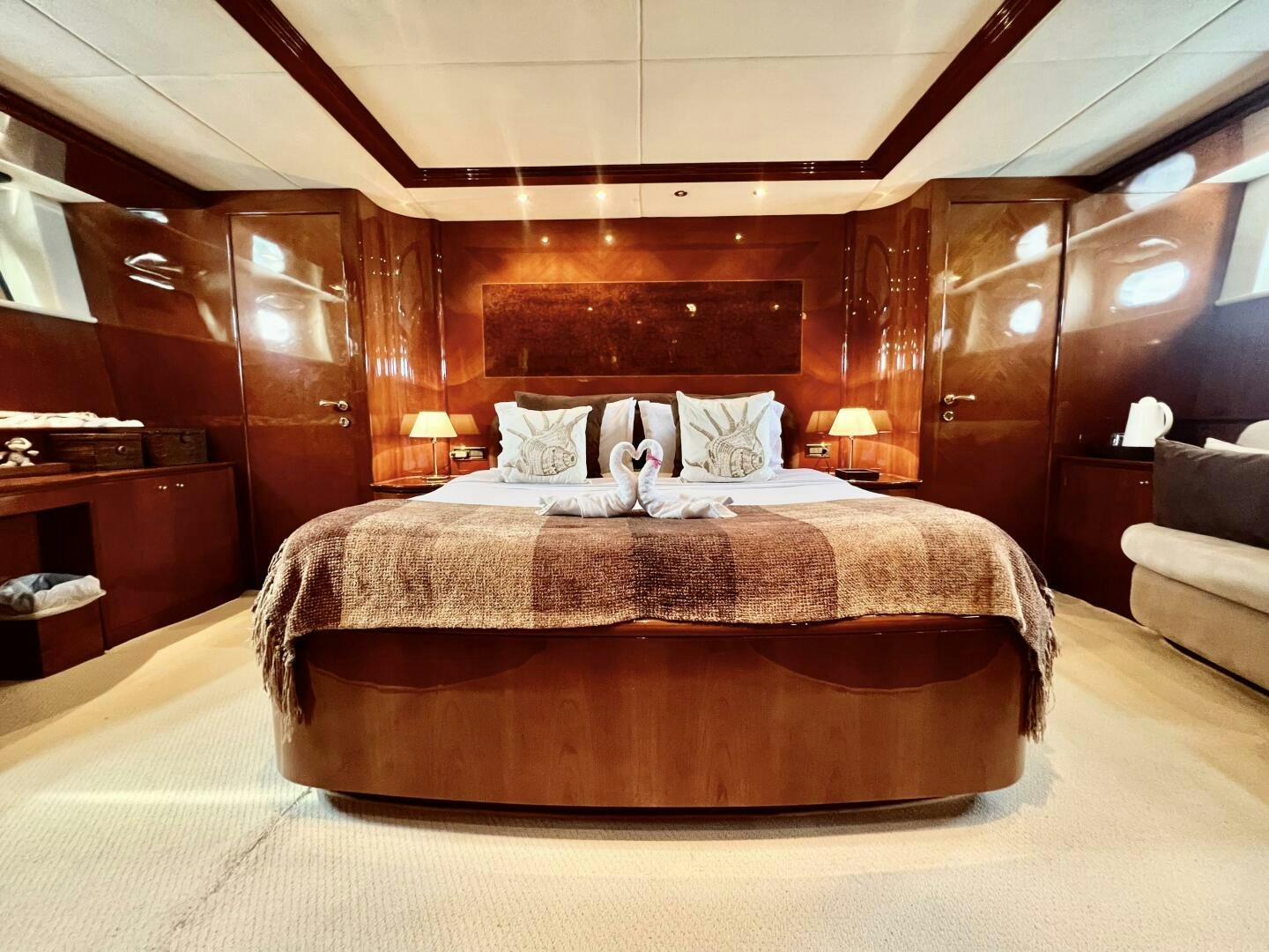 a bed with a dog on it aboard GARI Yacht for Sale