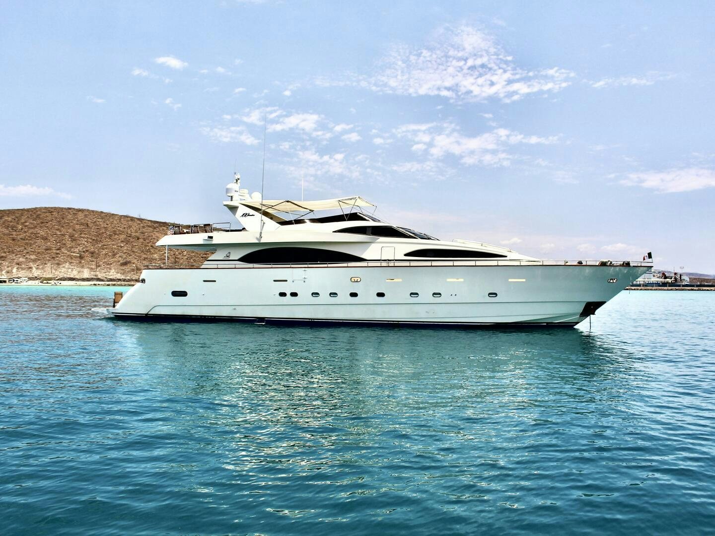 a white yacht in the water aboard GARI Yacht for Sale